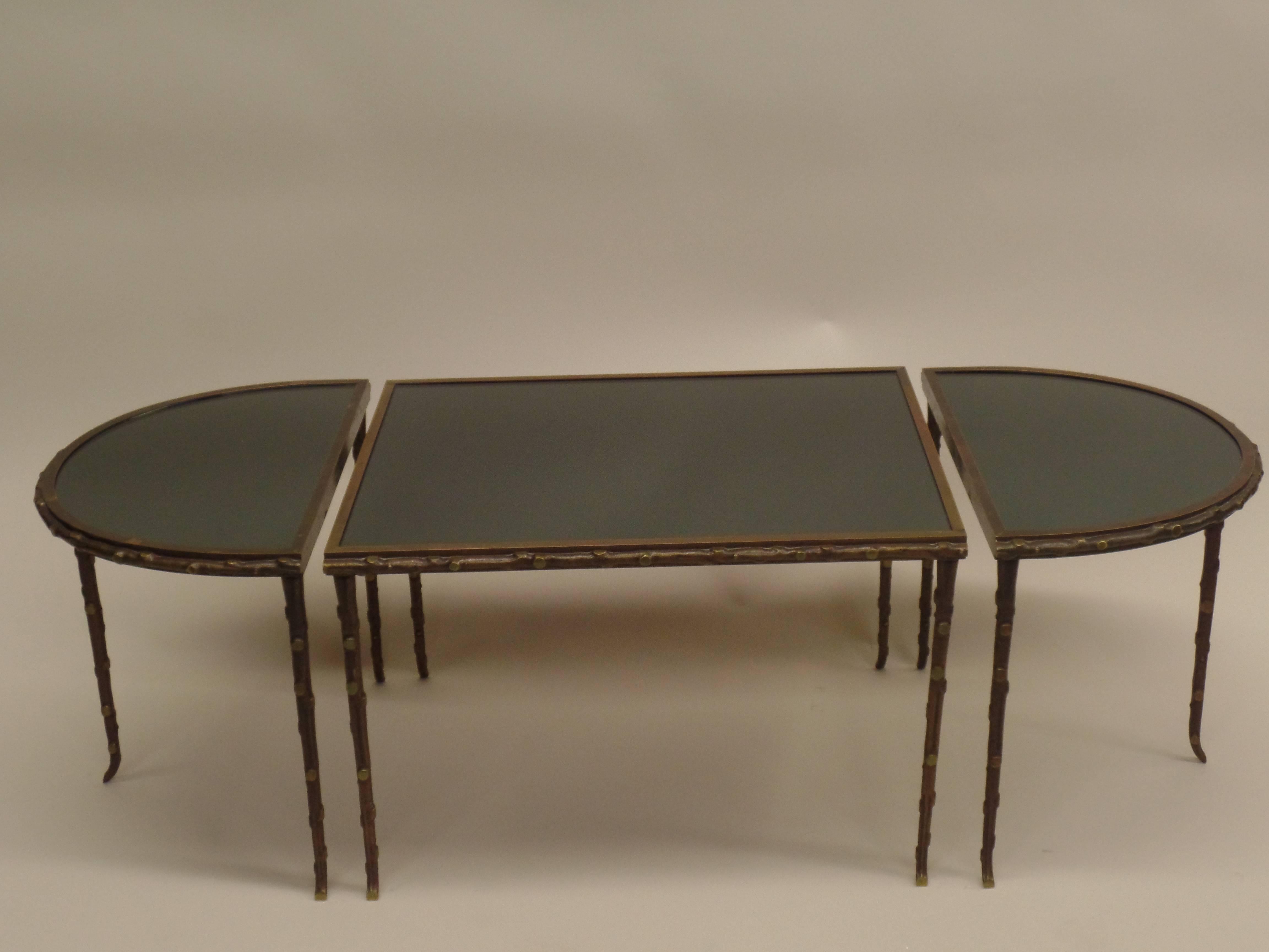 Important French midcentury cocktail table by Maison Baguès in the modern neoclassical taste. The table is composed of three parts that can separate and be used according to size and application as needed. The piece is made of solid bronze and