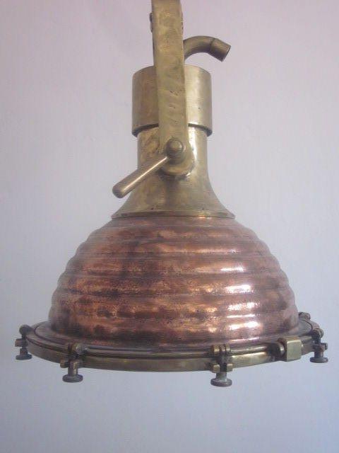 Two large Swedish midcentury marine Industrial chandeliers, pendants, flush mount fixtures or lanterns in solid brass and copper for a modern or traditional interior. There is a slight difference in the hanging mechanism of each piece.
Measures: 22