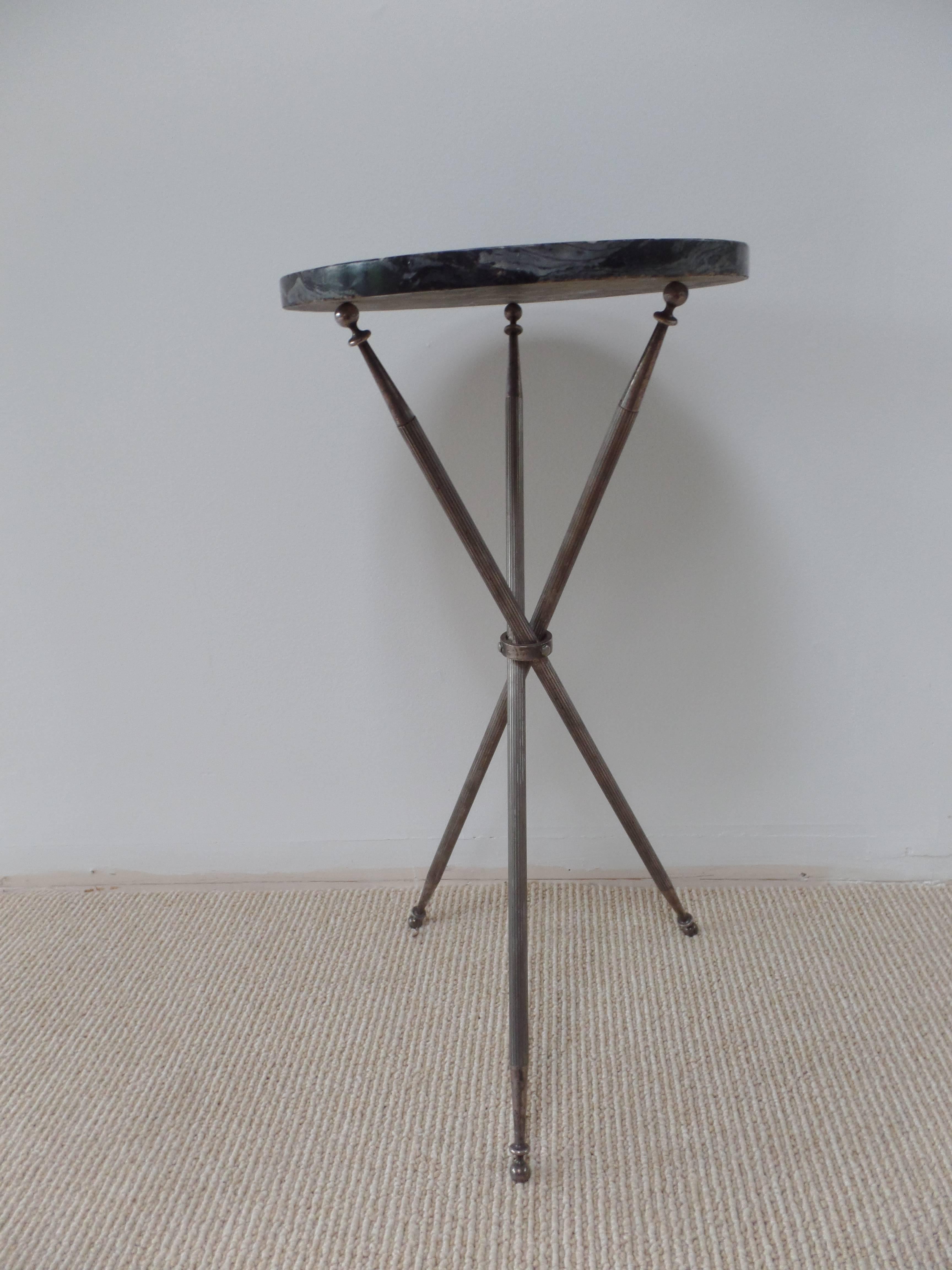 Important silver plated gueridon or side table in the style of Jean Michel Frank resting on a tripod Base with fluted legs and tapered sabots.