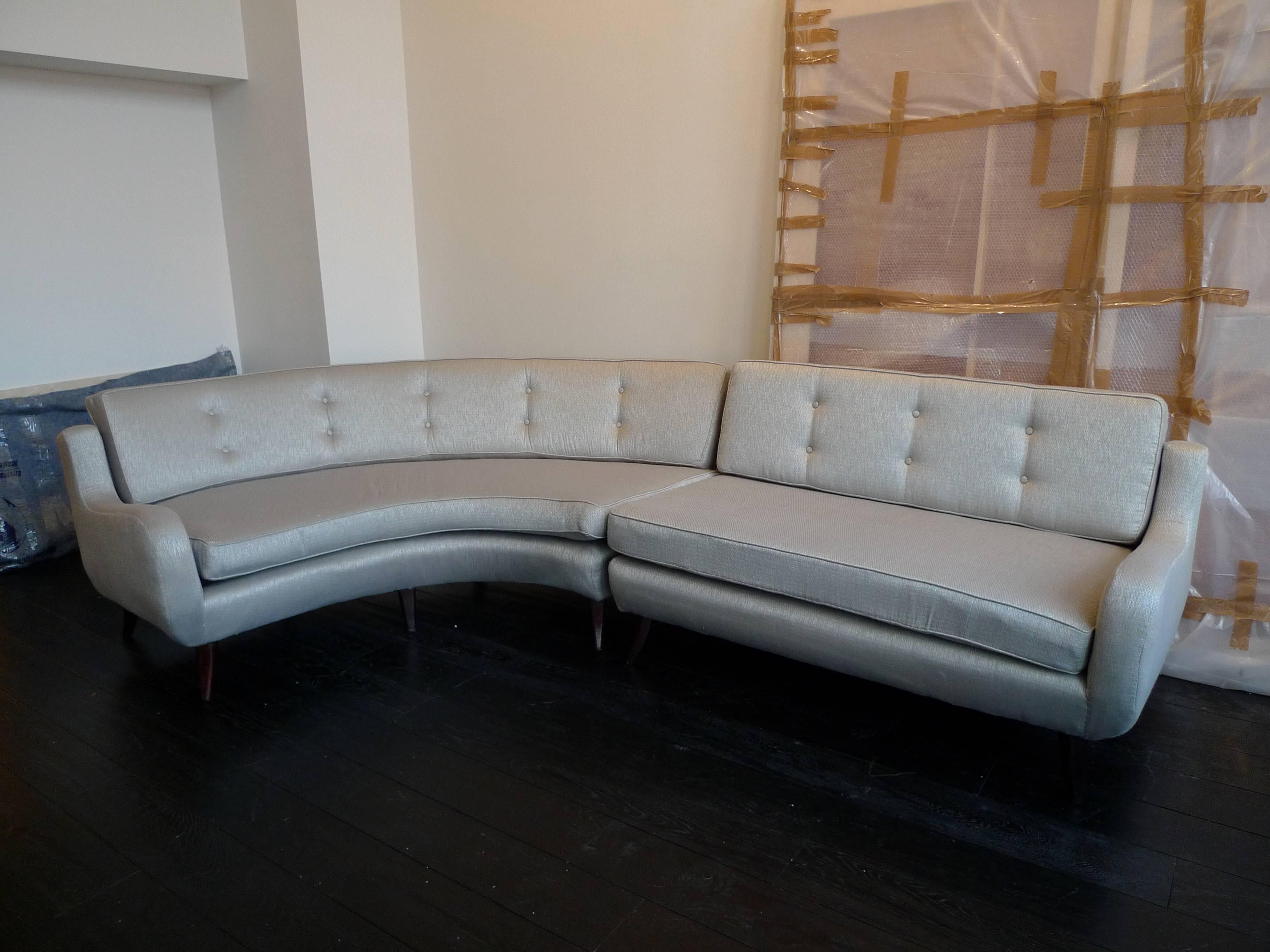 Ernst Schwadron - Two-piece sectional sofa wood and fabric, circa 1955.
Newly reupholstered.

Dimensions of each piece are:
Curved sofa: 72" L X 63" W x 35" D; 
Straight sofa: 57" L x 35" D.

Ernst Schwadron was born the