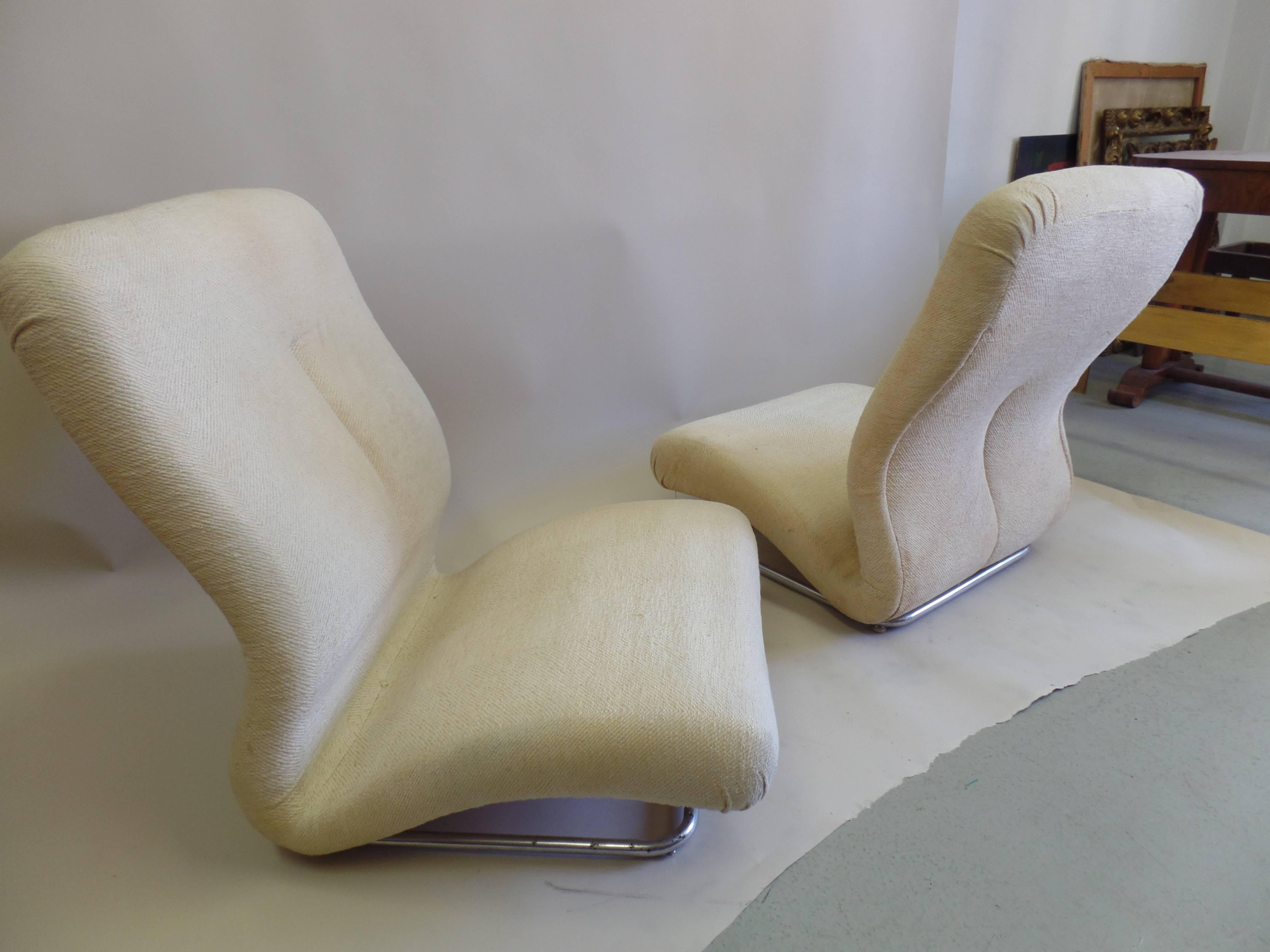 Important and ultra-cool pair of Italian Space Age / Mid-Century Modern armchairs known as 'Brevetti' by the boutique Italian (Bologna) company of IPE. 

These rare chairs feature a dynamic sense of movement and sit low to the ground, yet their high