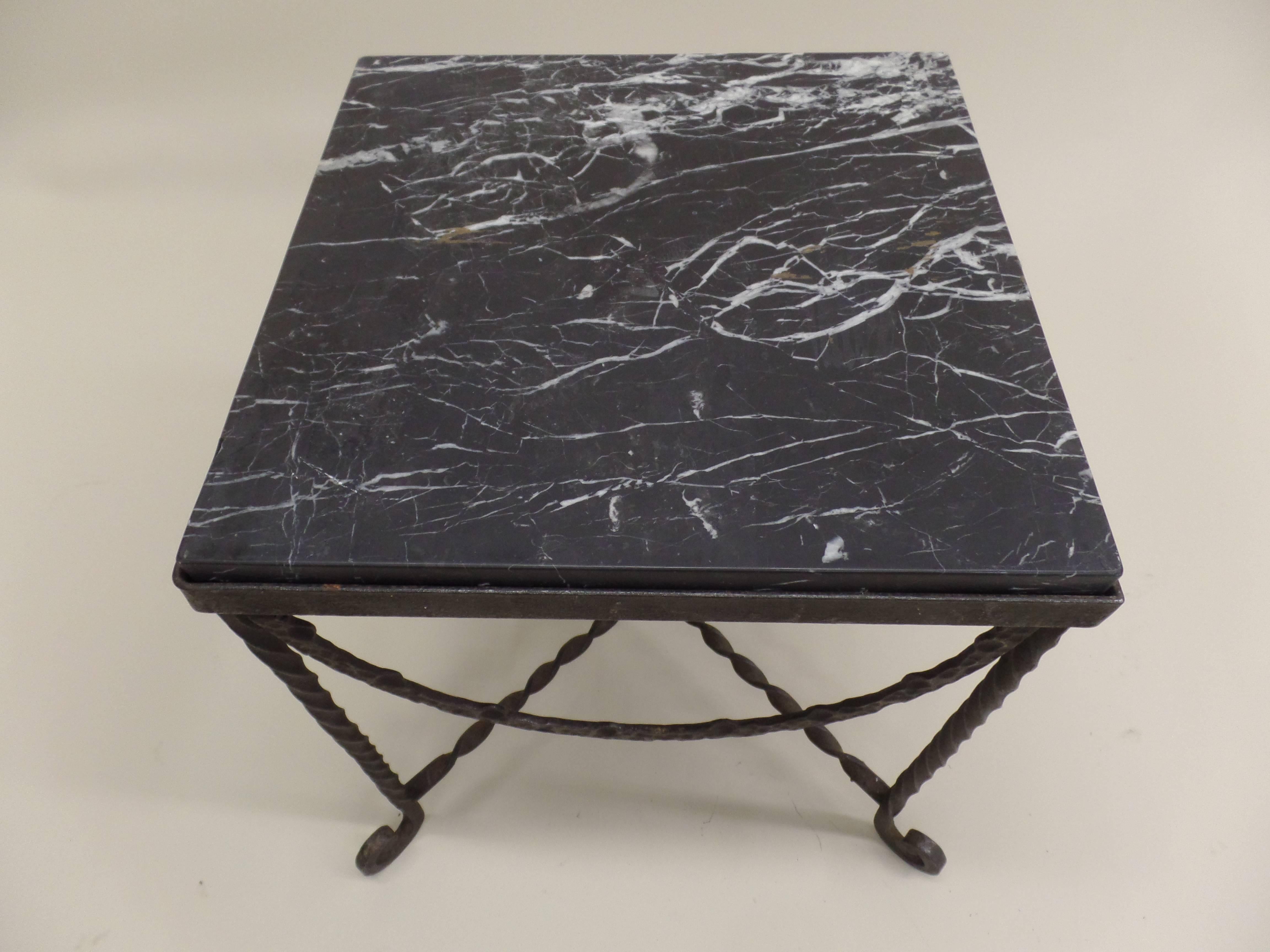 Rare, elegant pair of French Mid-Century hand-hammered forged iron end tables / nightstands / coffee tables. The pieces unite the neoclassical with the Modern and feature hammered iron garlands draping from each side of the table. These are typical