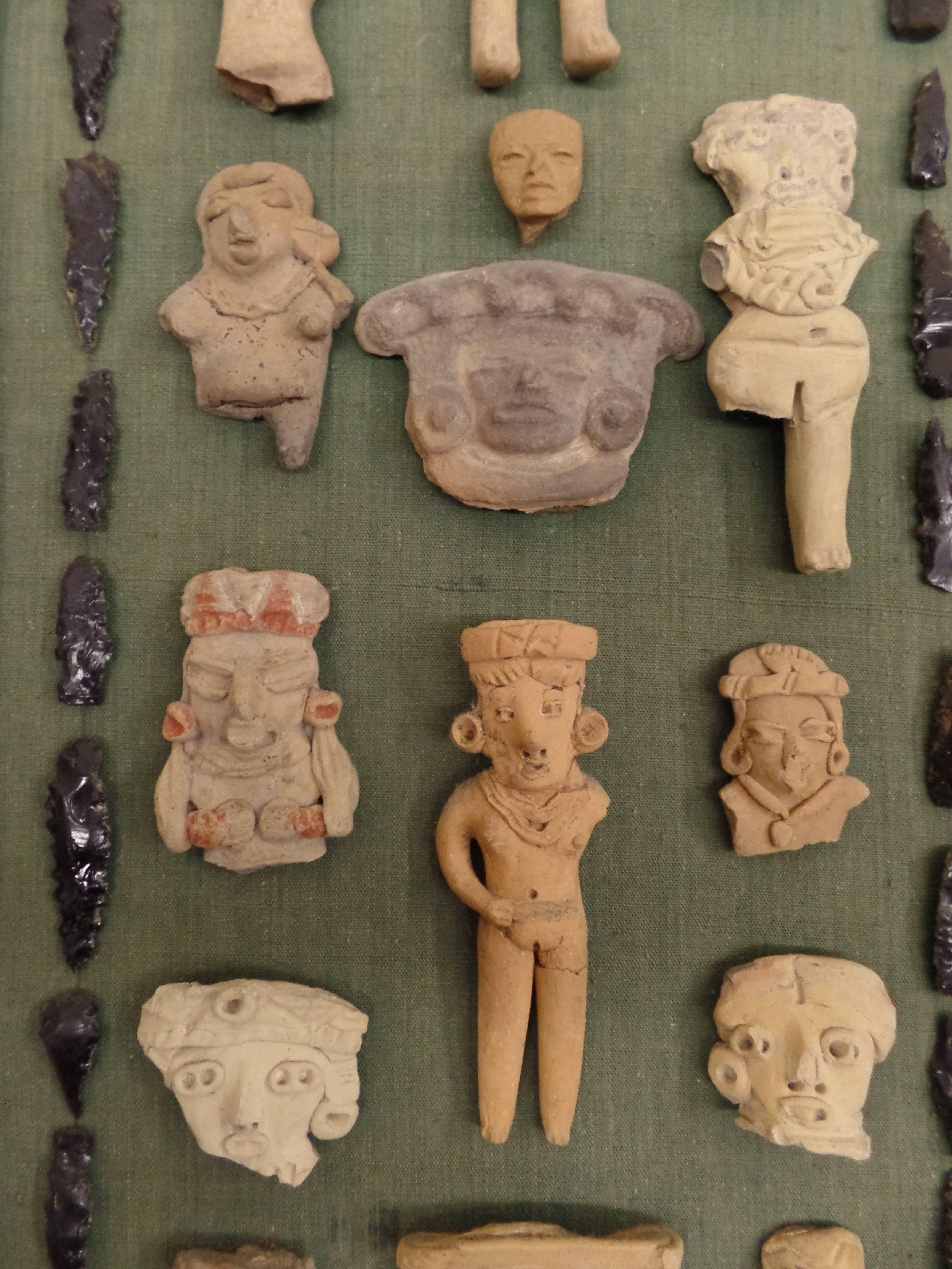 Pre-Columbian Framed Collection of Mesoamerican Pre-Classic Period Sculptures & Arrow Heads   For Sale