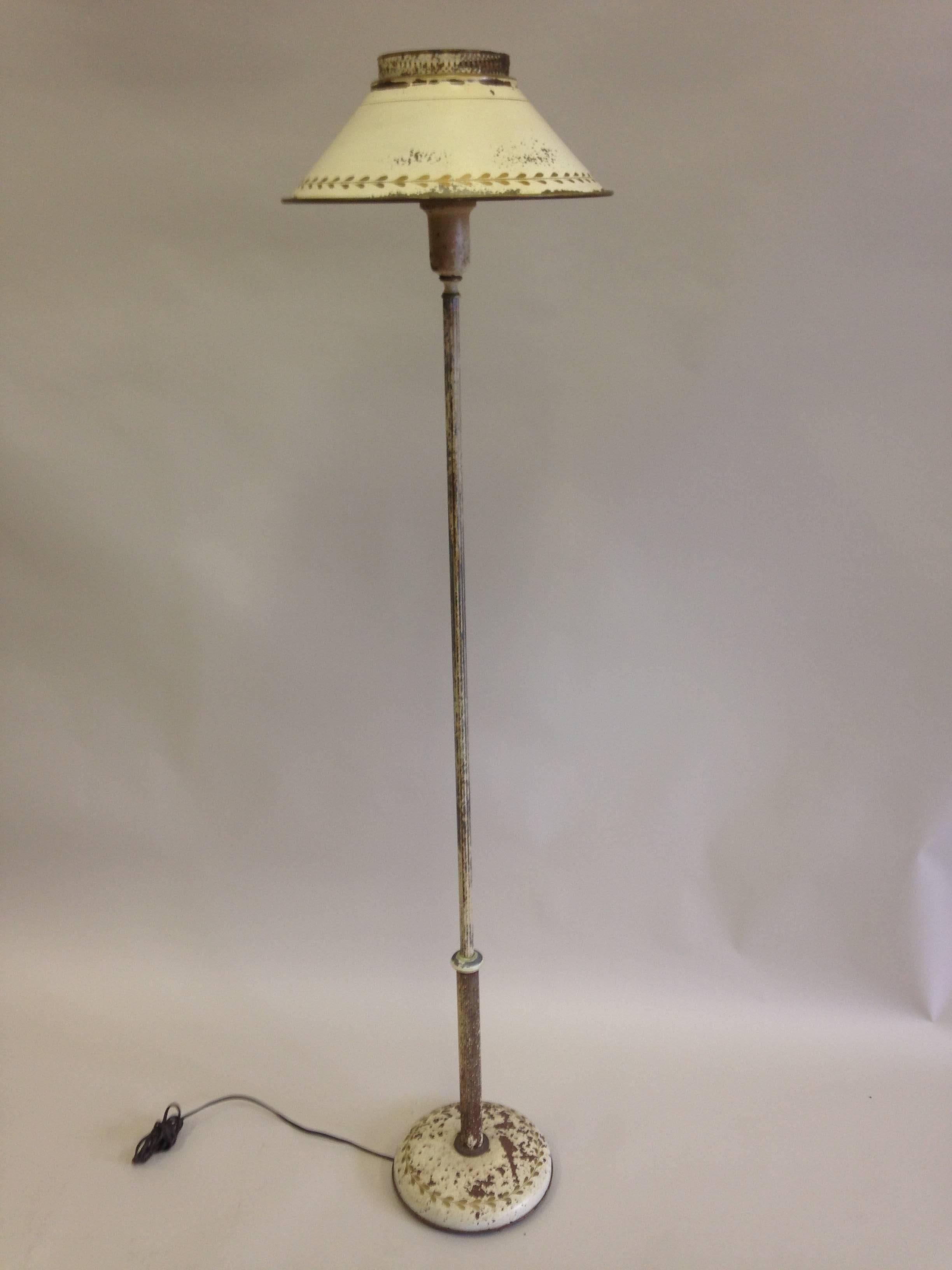 Chic and timeless French Mid-Century floor lamp in white painted tole. The patina is naturally distressed and naturally acquired over 90 years of life. 