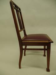 Four French Early Modernist Wood Dining Chairs with Inlaid Brass Grid Back