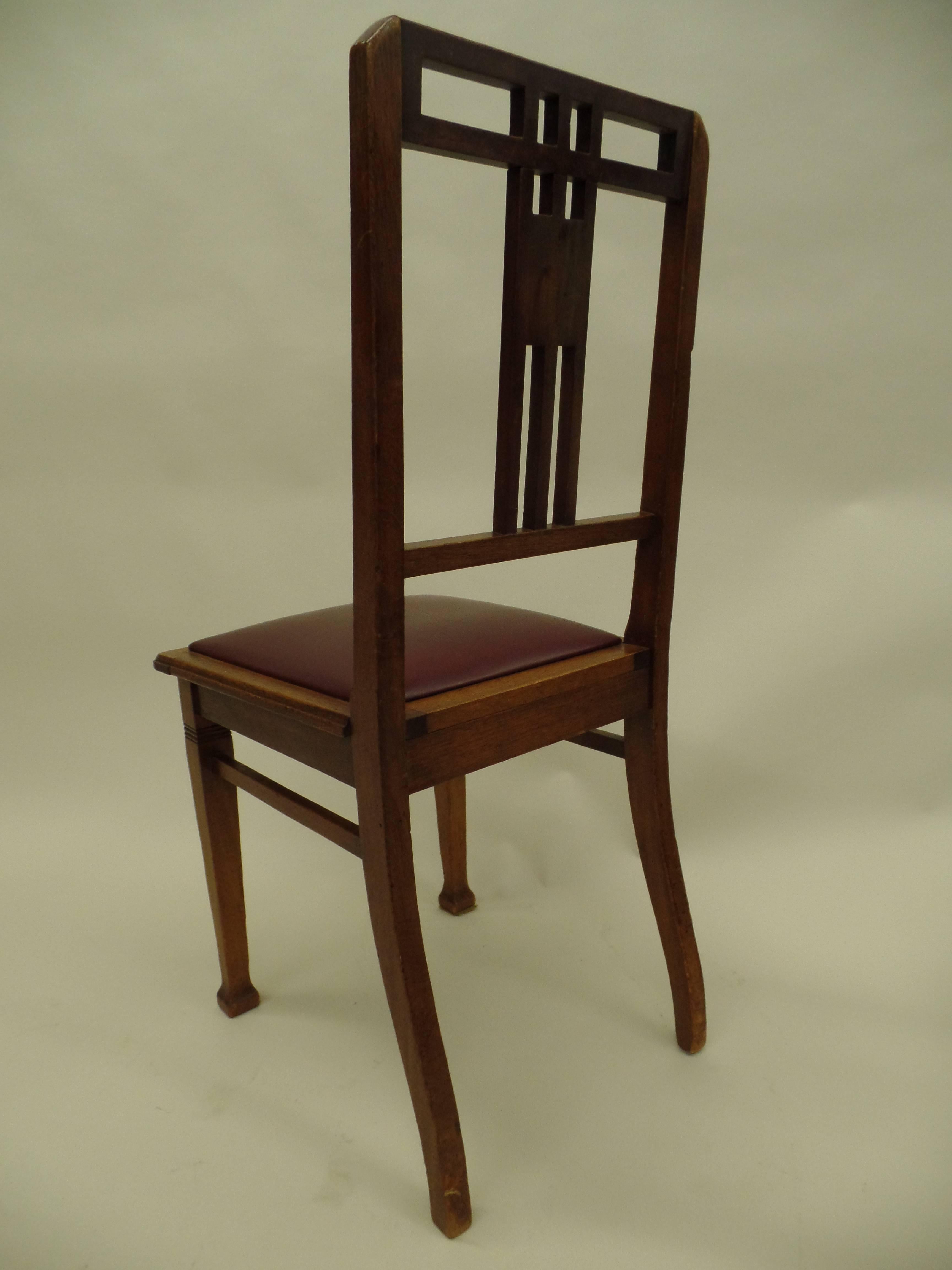Hand-Crafted Four French Early Modernist Wood Dining Chairs with Inlaid Brass Grid Back For Sale