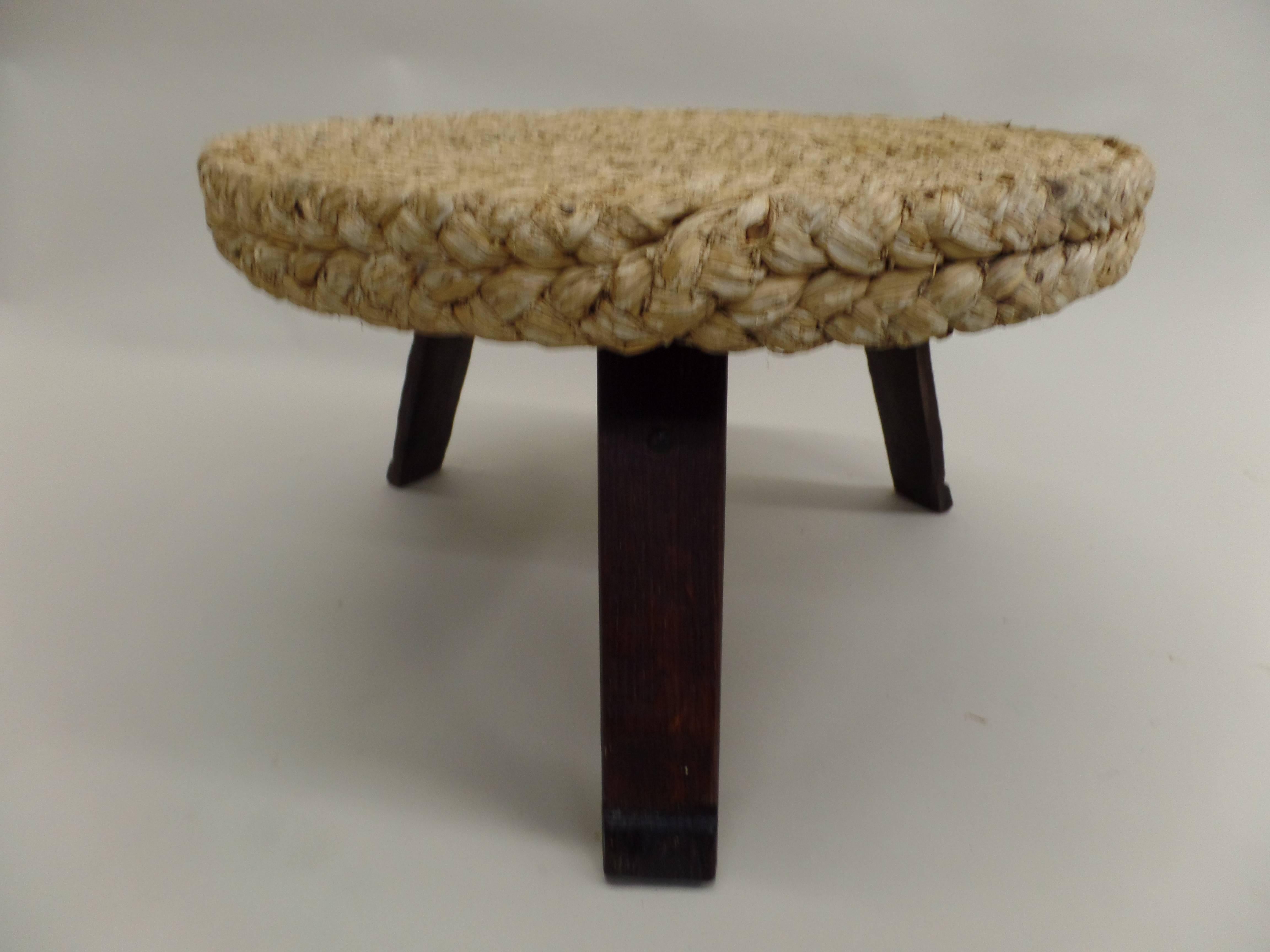 A French Mid-Century round cocktail table in woven rush by Adrien Audoux and Frida Minet.