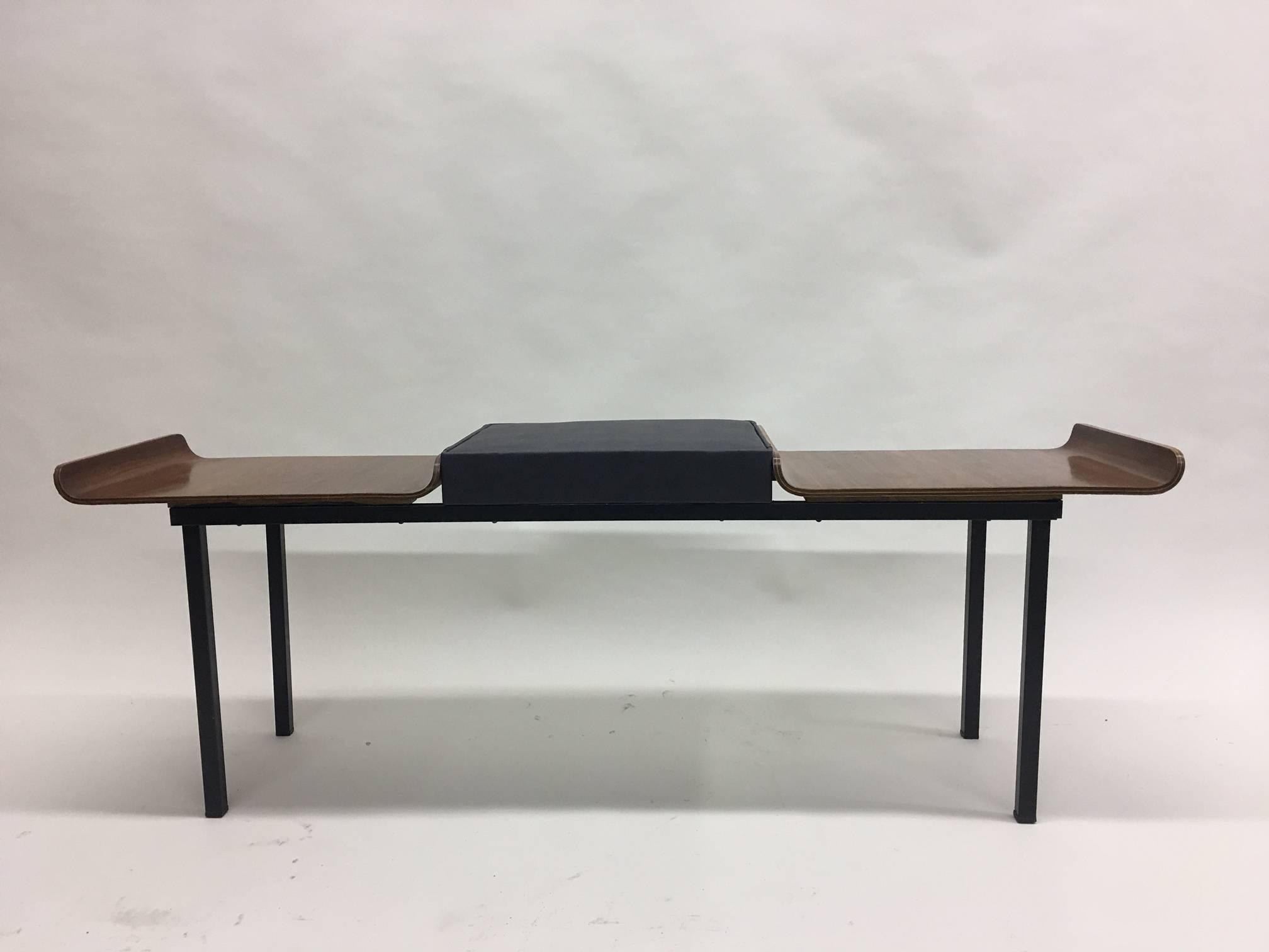 Elegant Italian mid-modern / Minimalist bench resting on enameled metal legs with molded plywood seats and a center seat in leather-like material. 

The entire composition forms with black leather central seat accompanied by 2 wood side seats