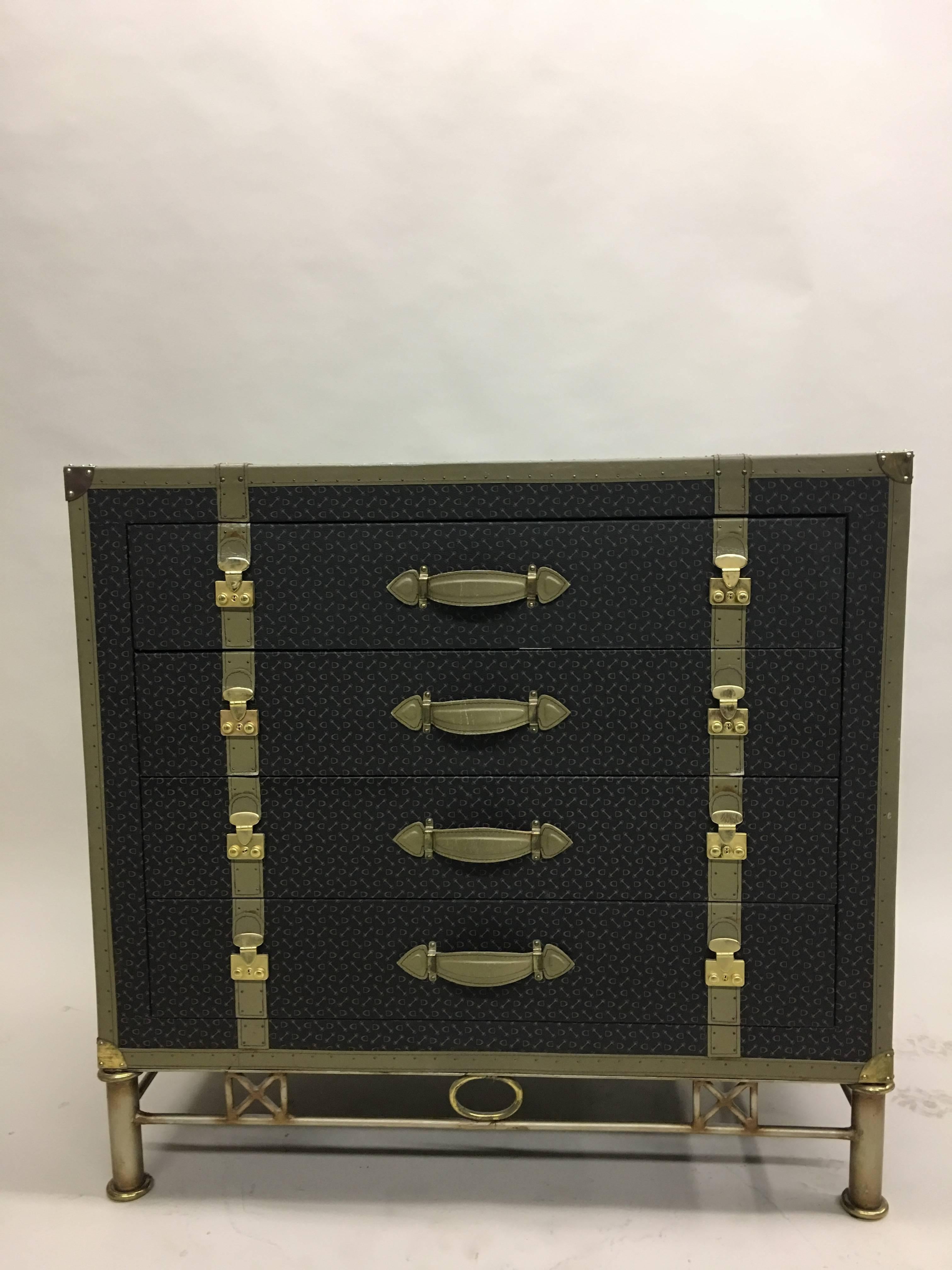 Elegant, Handsome French chest of drawers or commode in the style of a Louis Vuitton trunk with two drawers and one double door storage space.

The piece features all stitched leather handles and strapping, solid brass corner caps and a bonded