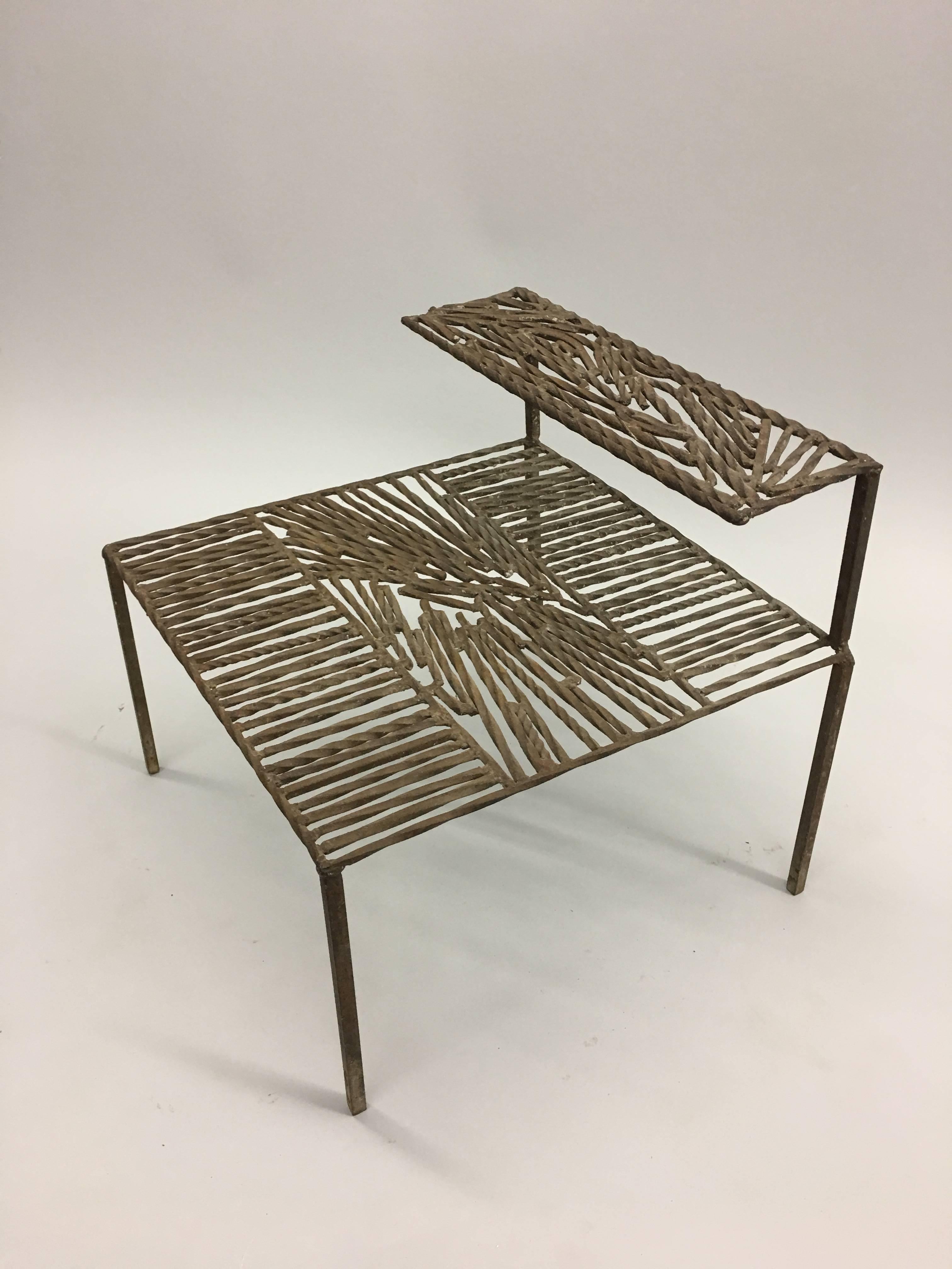 Wrought iron sculpture constructed in the form a double level table
Italy, circa 1967

The top of each level is constructed as an Arte Povera / Post-Minimalist sculpture with parallel rods of iron being intercepted by diagonal
