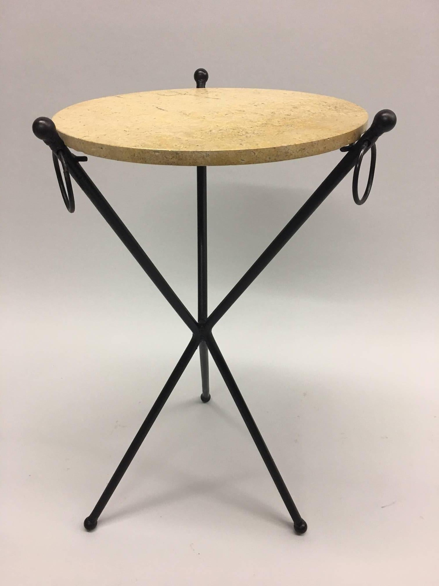 2 Elegant and Timeless French Mid-Century Modern Neoclassical Style End or Side Tables/ Nightstands /Gueridons in an exquisite, balanced tripod form. The tables are composed of hand-wrought iron with black patina in the style of Jean-Michel Frank.