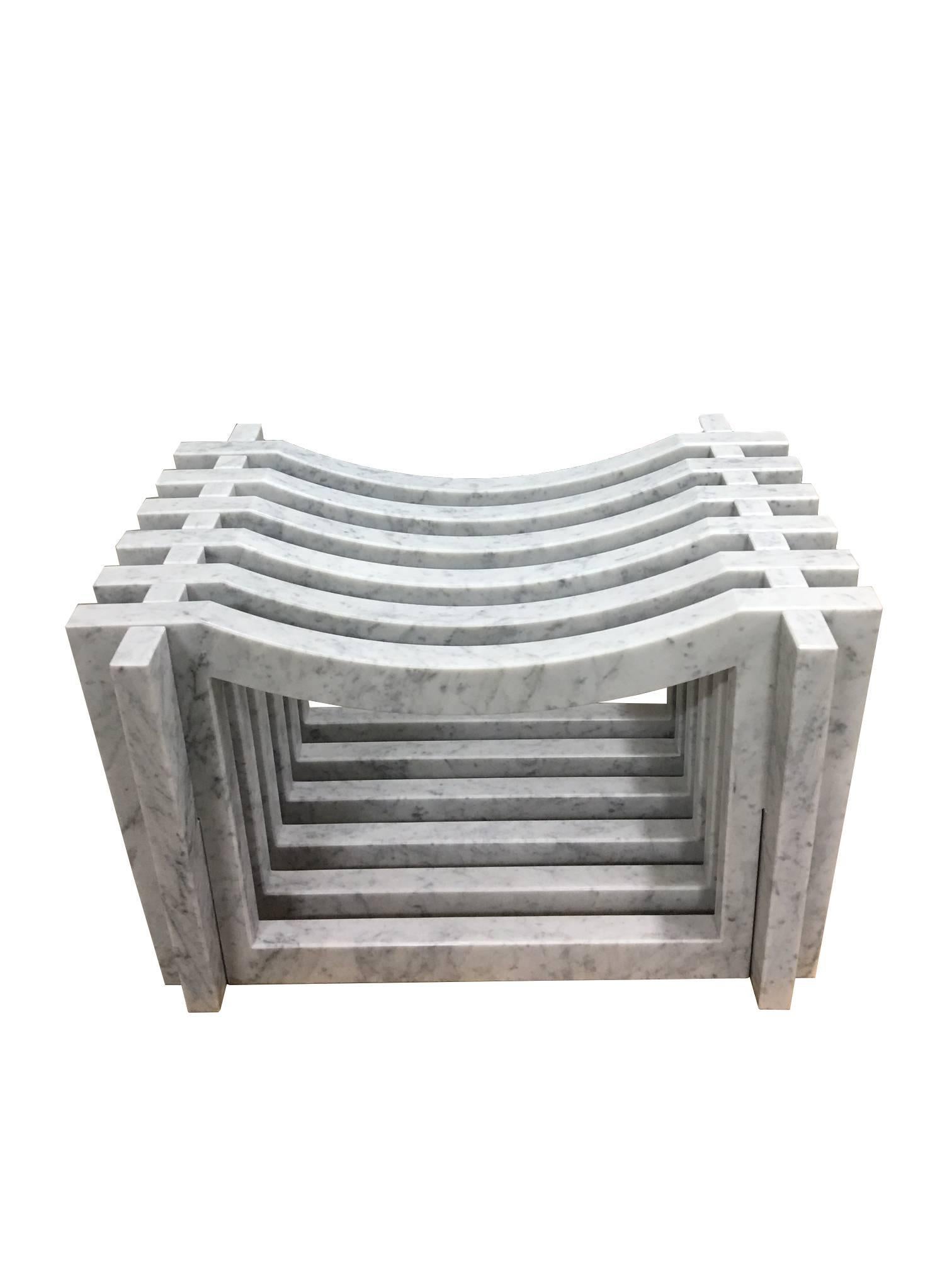 Italian white Carrara marble benches or stools in a Minimalist aesthetic. Ideal for bath room and shower or garden. The benches are constructed with 6 pieces of marble on 2 inter-stacked open framed marble parts that form the base. Also available in