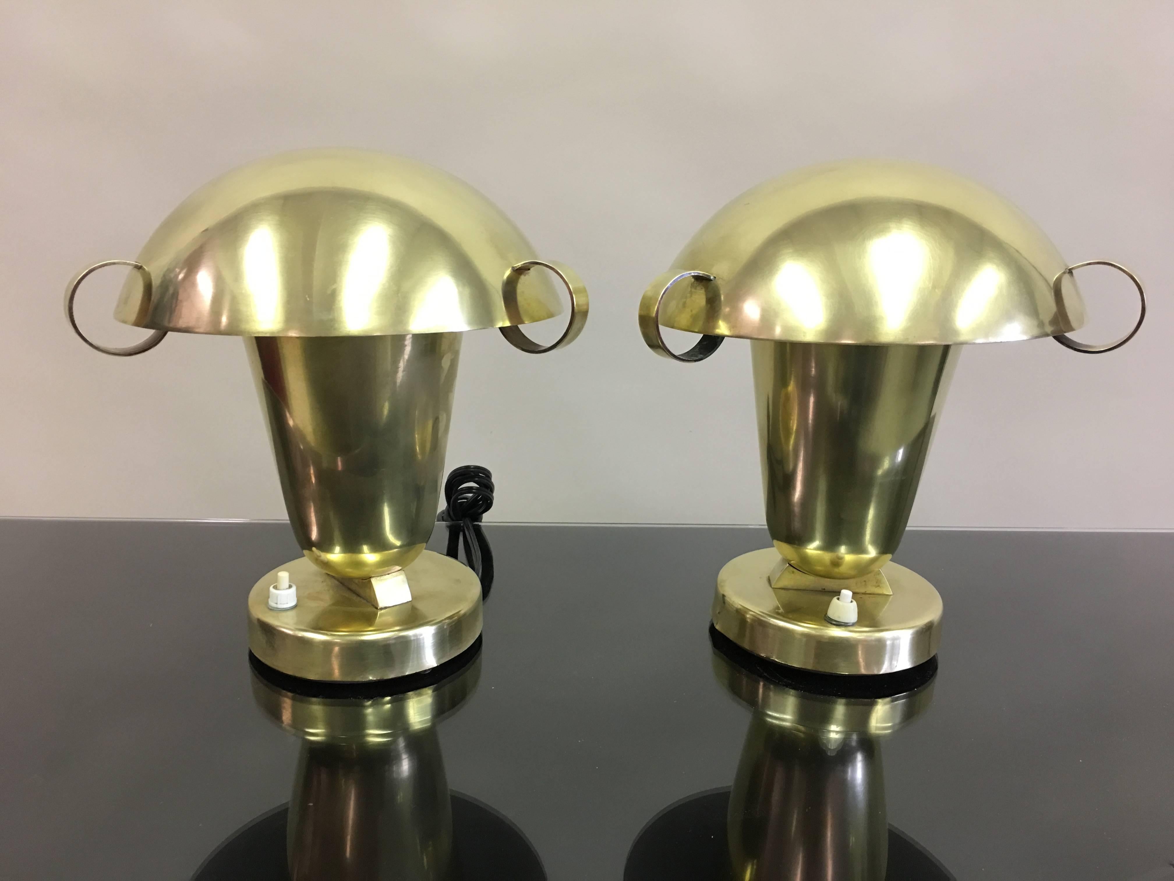 A rare and elegant pair of Italian Mid-Century Modern Neoclassical solid brass 
 table lamps / desk lamps / bed-side or nightstand lamps, attributed to Pietro Chiesa and in the style of Fontana Arte, circa 1930. The lamps possess a rare design