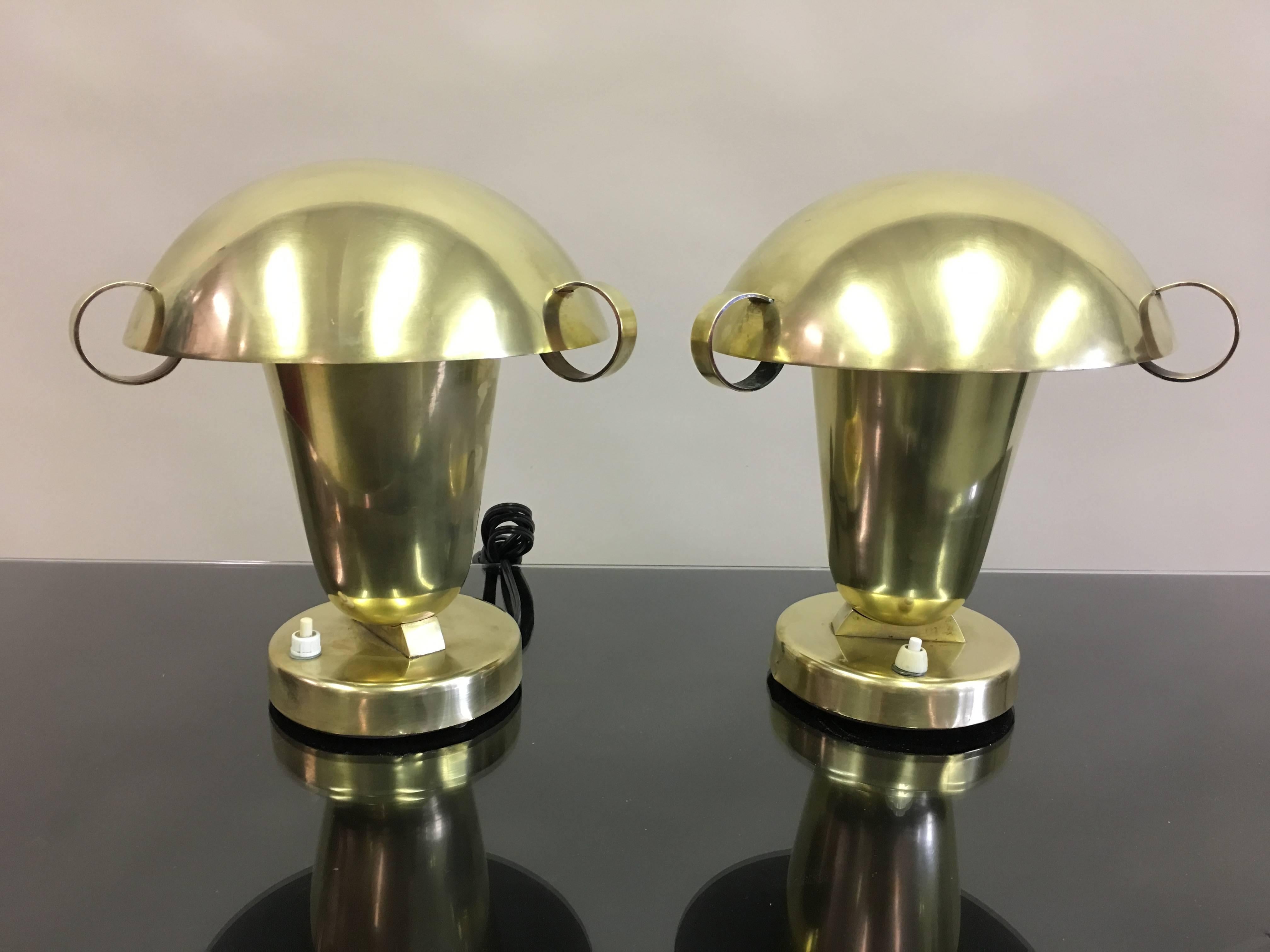 A rare and elegant pair of Italian Mid-Century Modern Neoclassical solid brass 
 table lamps / desk lamps / bed-side or nightstand lamps, attributed to Gio Ponti and Pietro Chiesa for Fontana Arte, circa 1930. The lamps possess a rare design