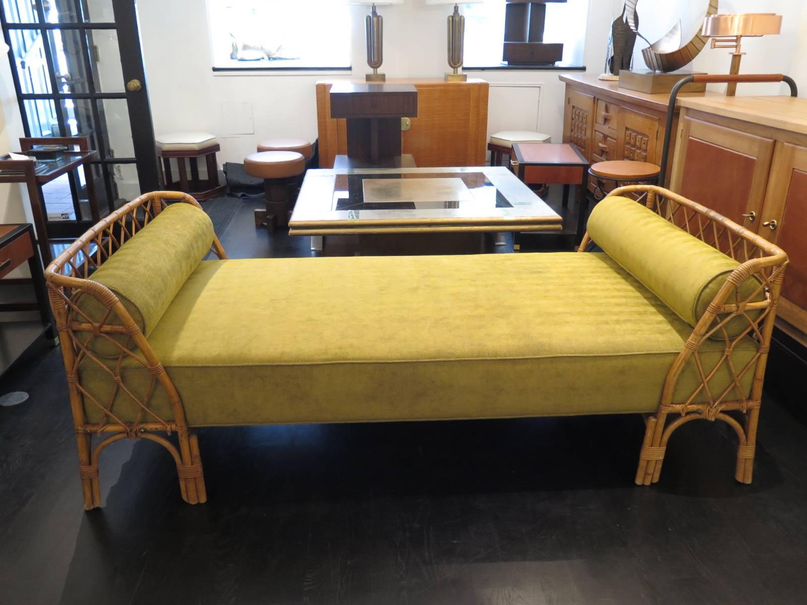 Rattan daybed by Louis Sognot with new upholstery. Original finish with
brass hardware. Beautiful scale and design.