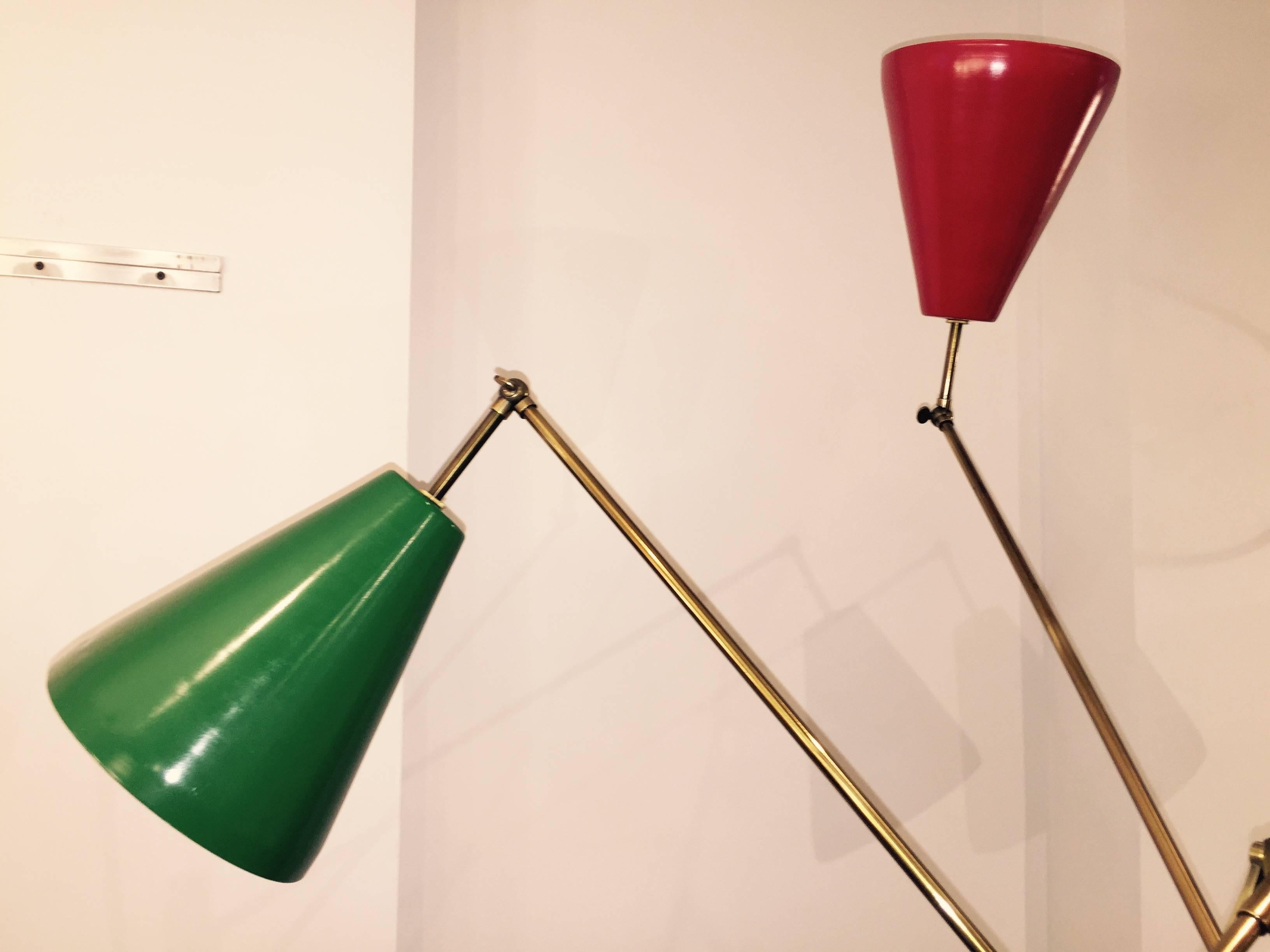 Triple shade Arredoluce style floor lamp. Adjustable brass arms with articulated shades.