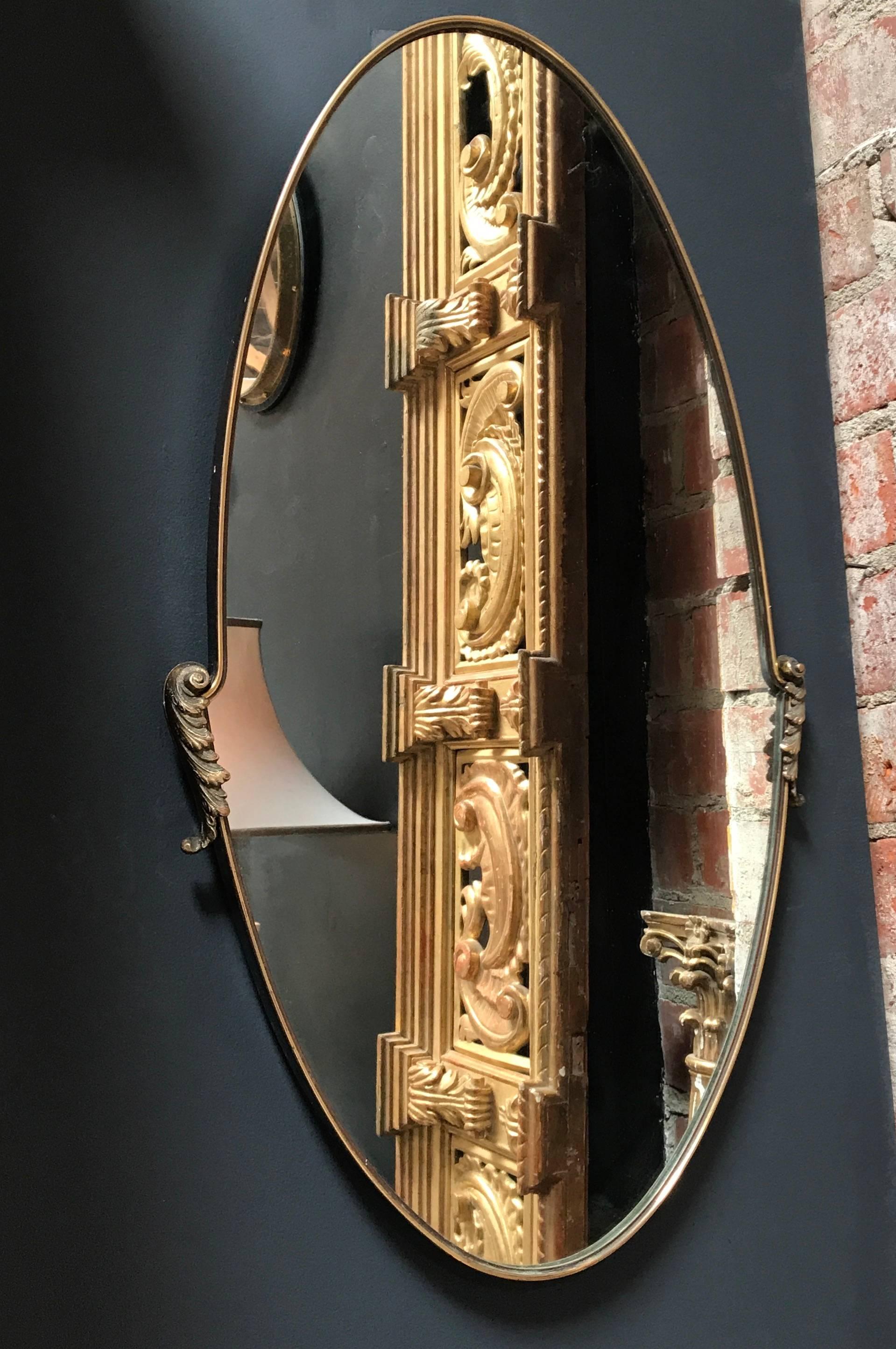 Mid-Century Italian oval mirror with brass frame, circa 1950s.
