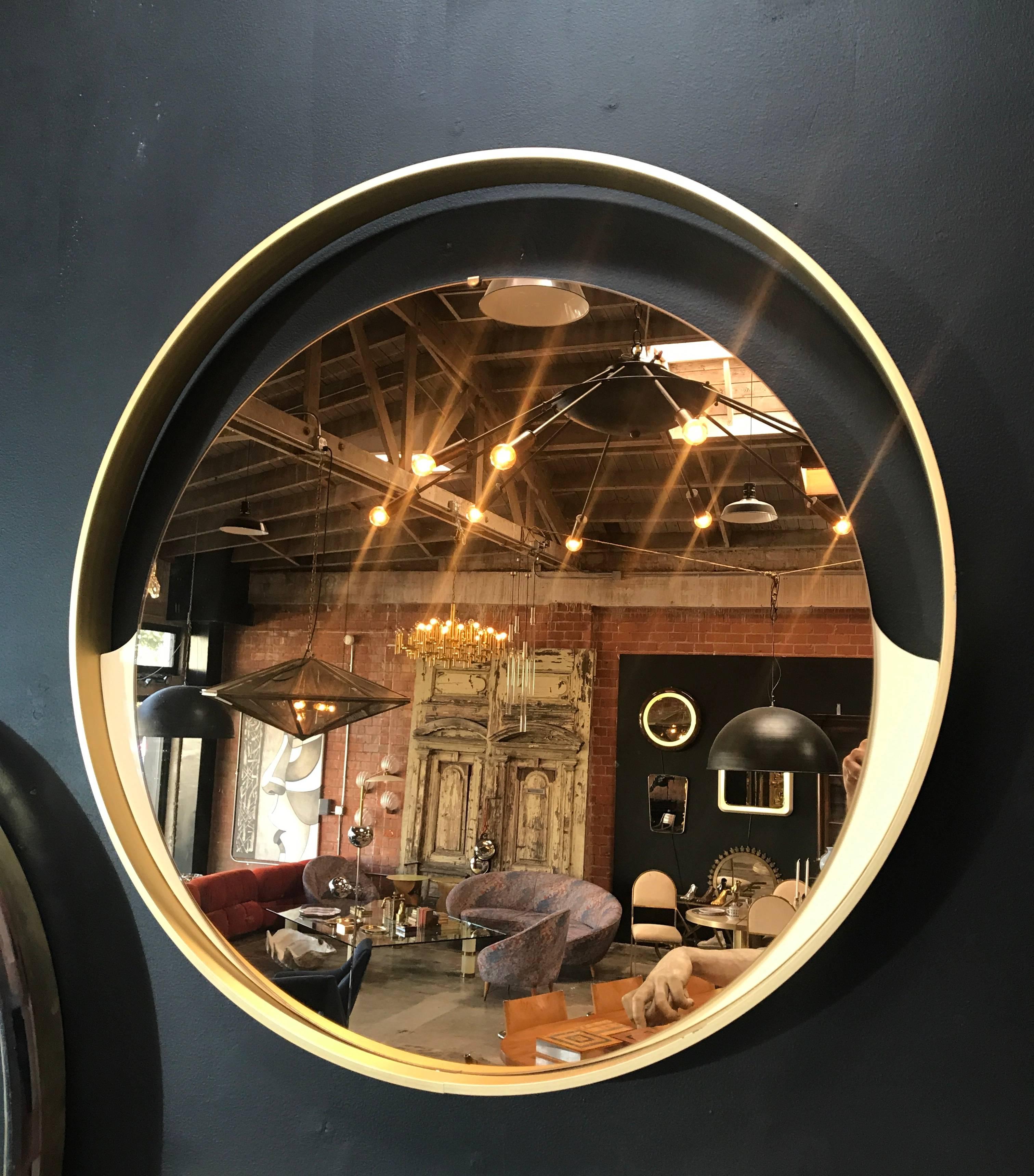 Italian, 1970s big round mirror with brass frame.