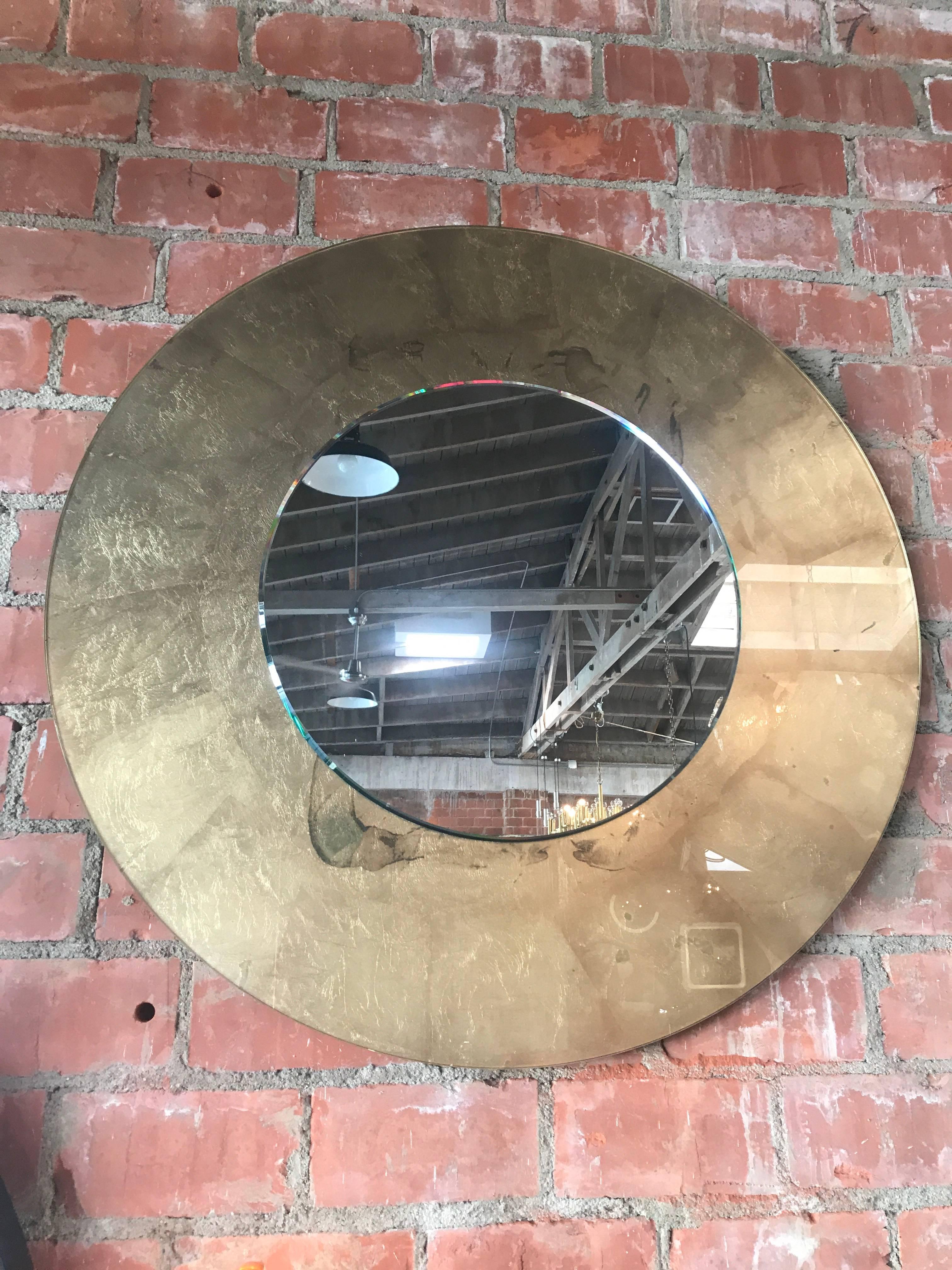 Italian round mirror with gold leaf, circa 1980.