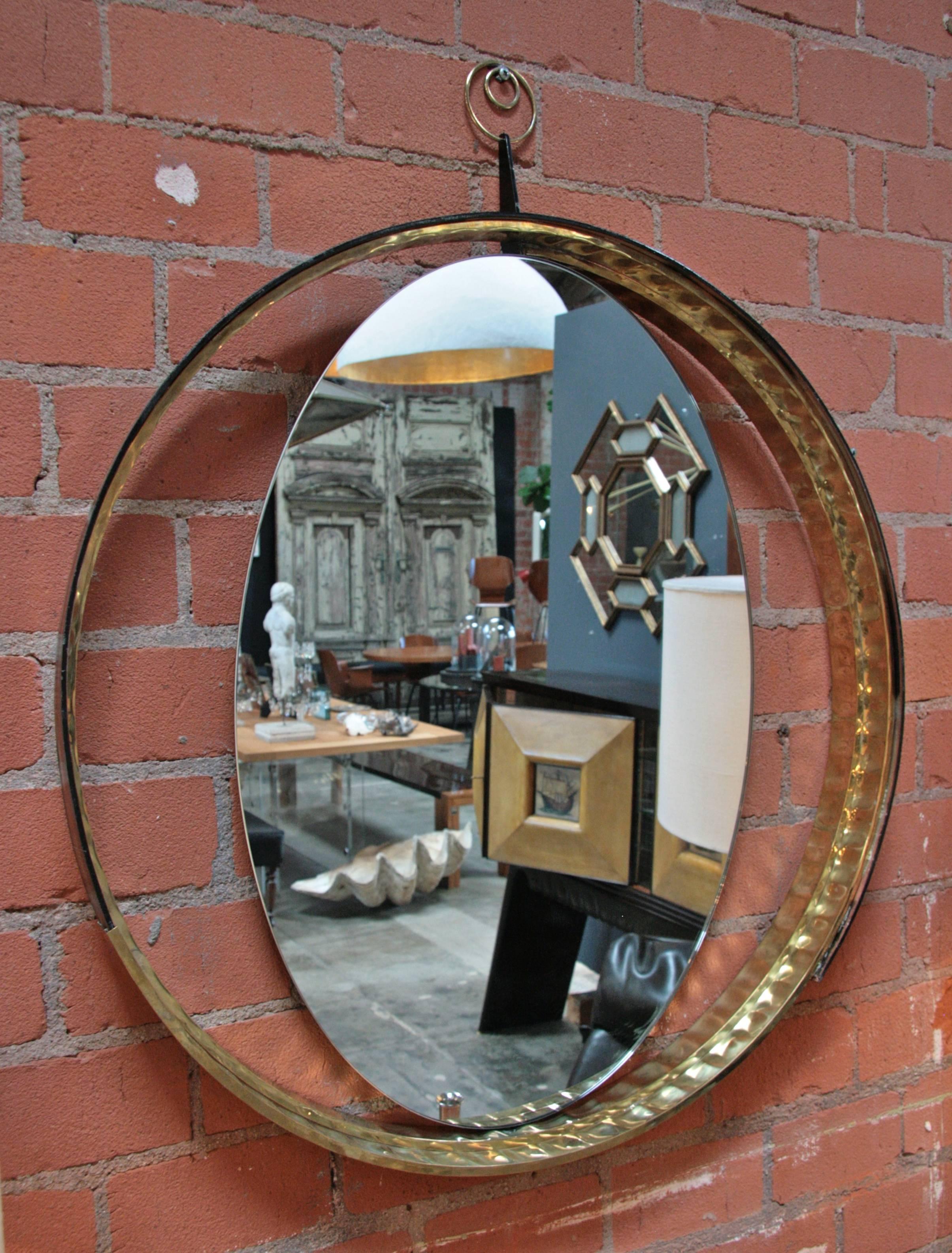 Italian mirror with wood and brass frame.