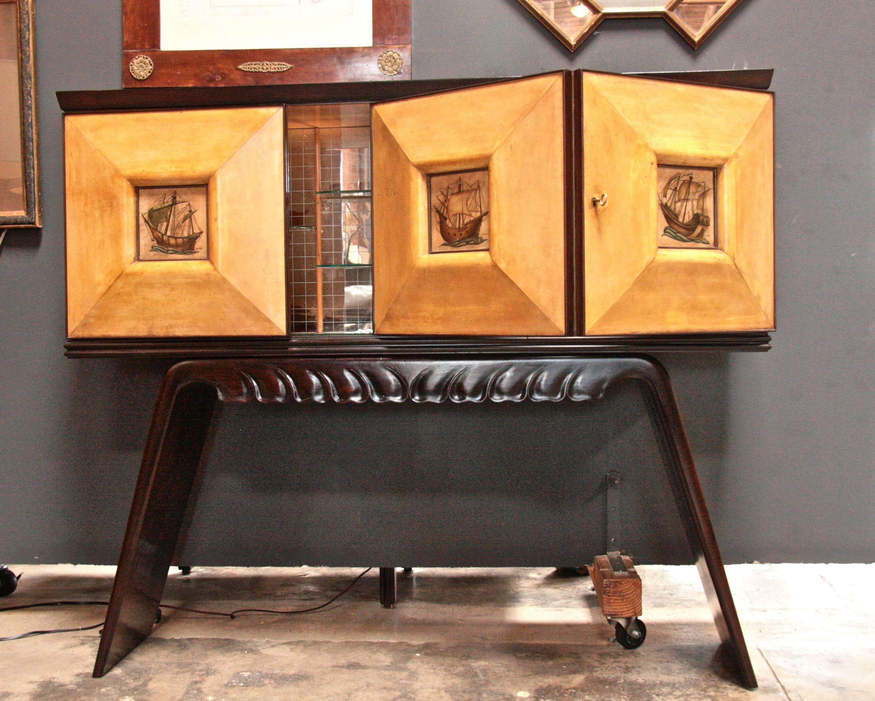 Italian 1950s bar cabinet attributed to Paolo Buffa in mahogany and birch with parchment paper painted panels.