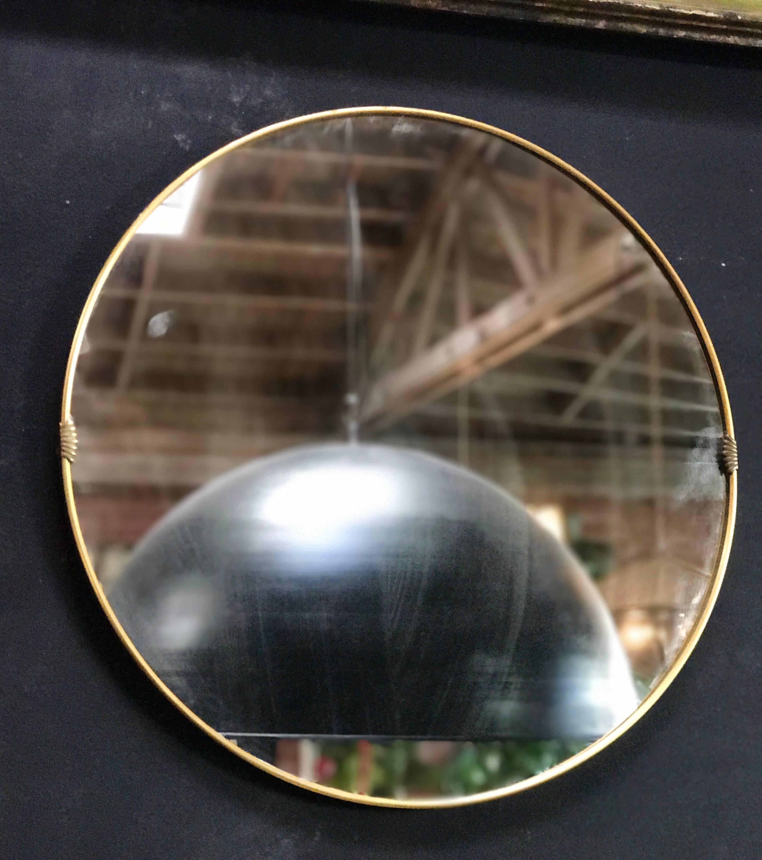 Italian 1950s round mirror with brass frame.