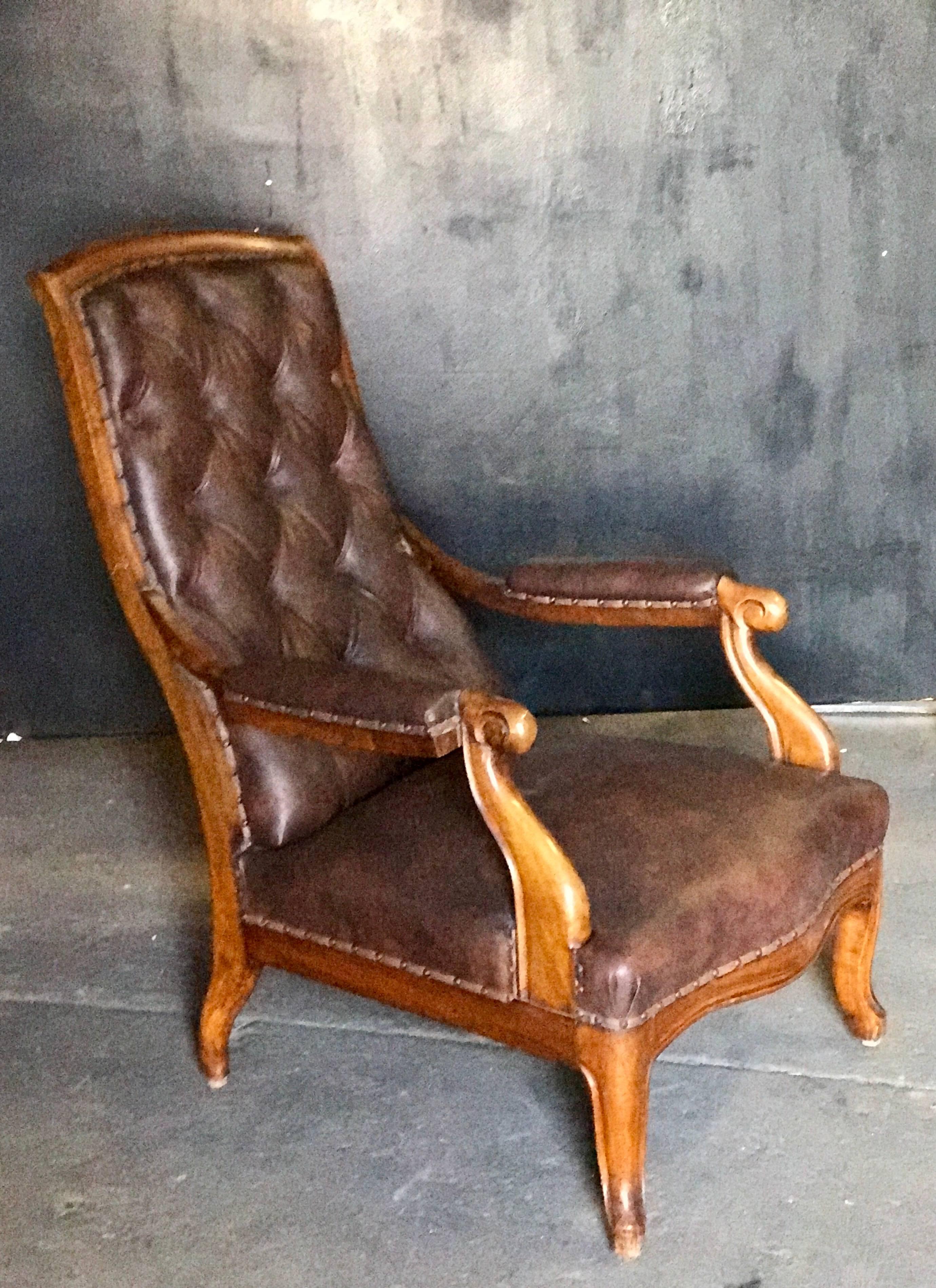 Italian tufted leather and walnut bergère.