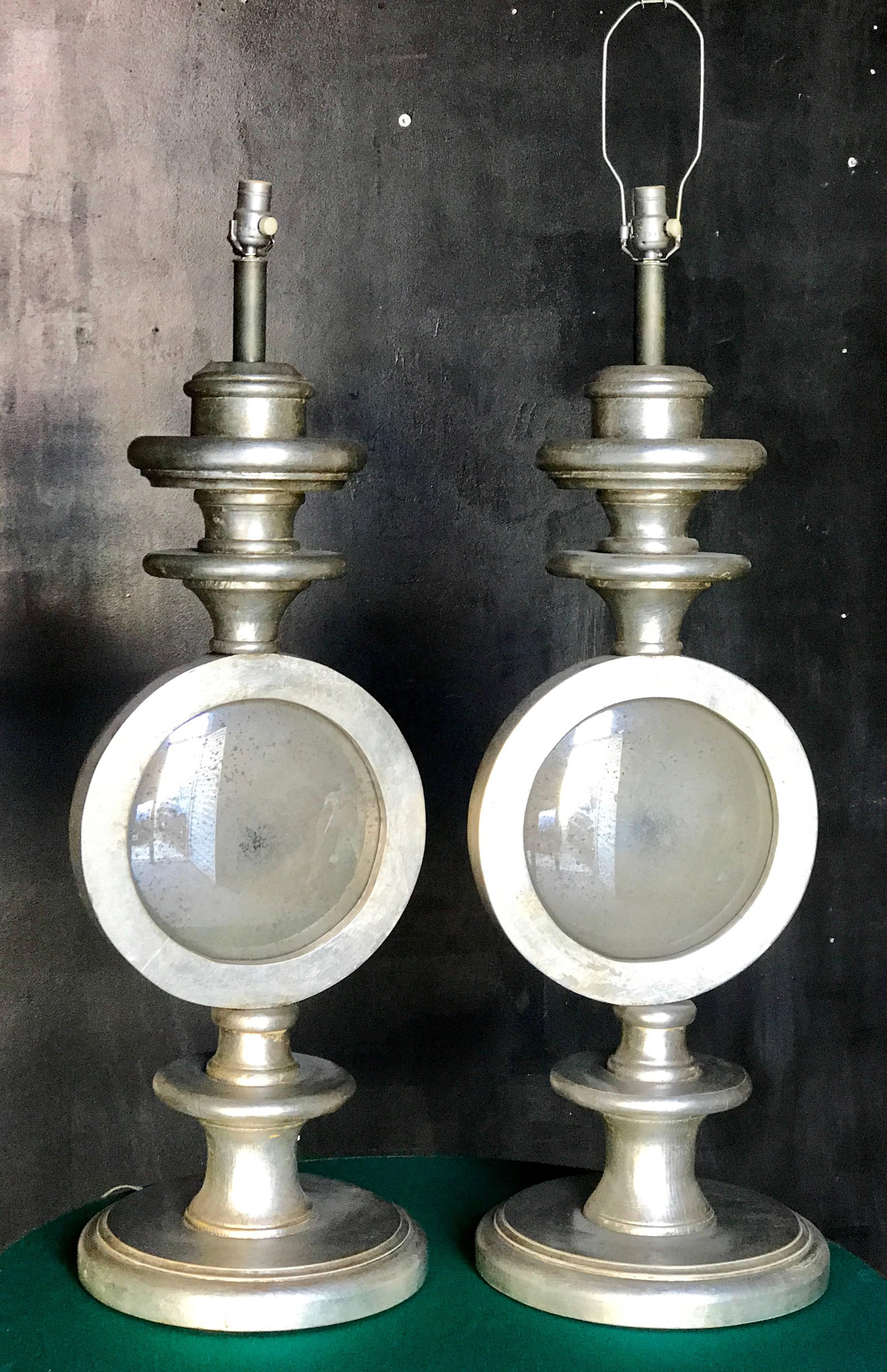 Pair of oversize Italian silver leaf table lamps with antique mirror.