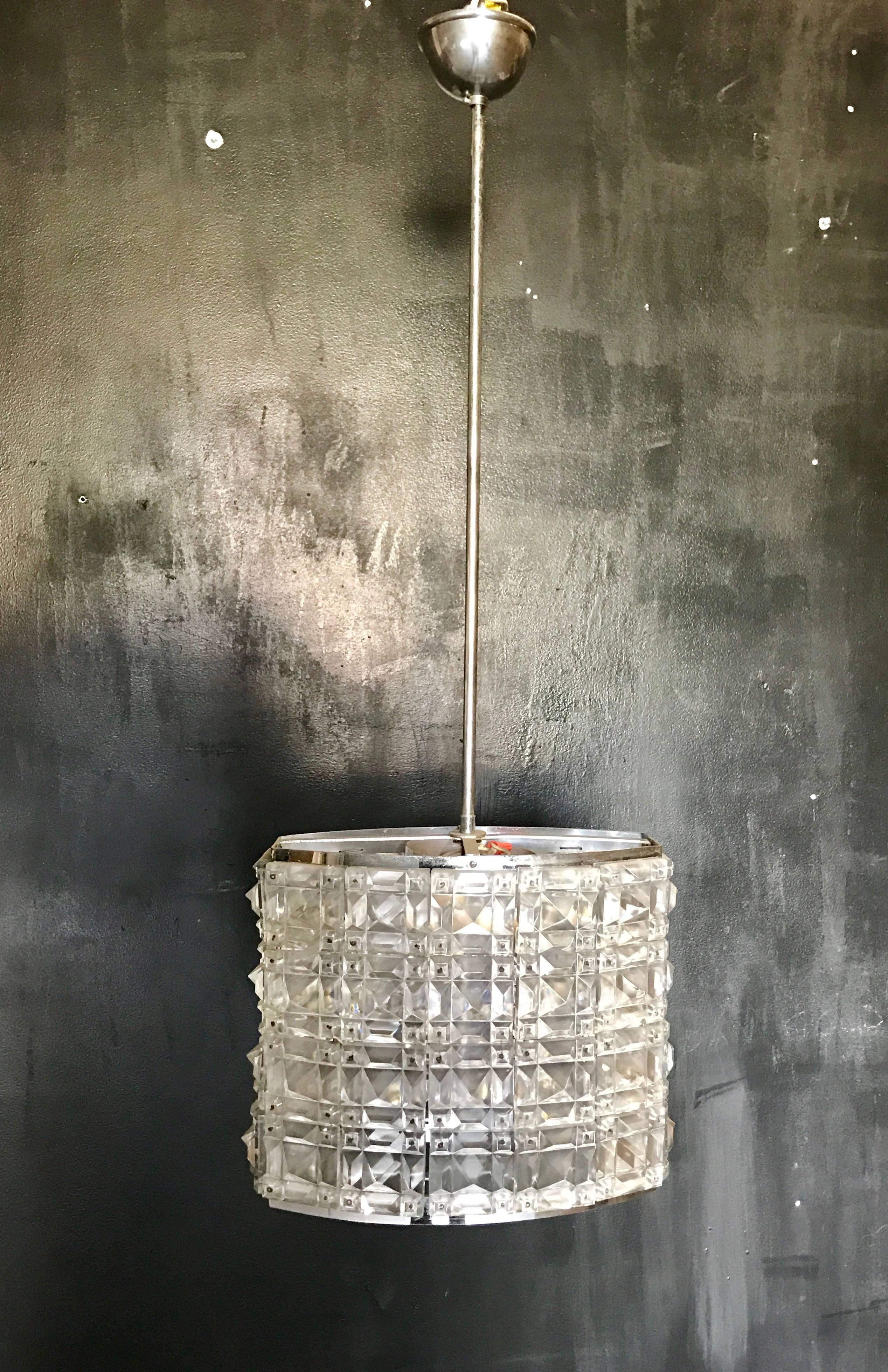 Italian Mid-Century crystal pendant chandelier with steel structure. All the crystals have the geometric shape. Very simple but very elegant.