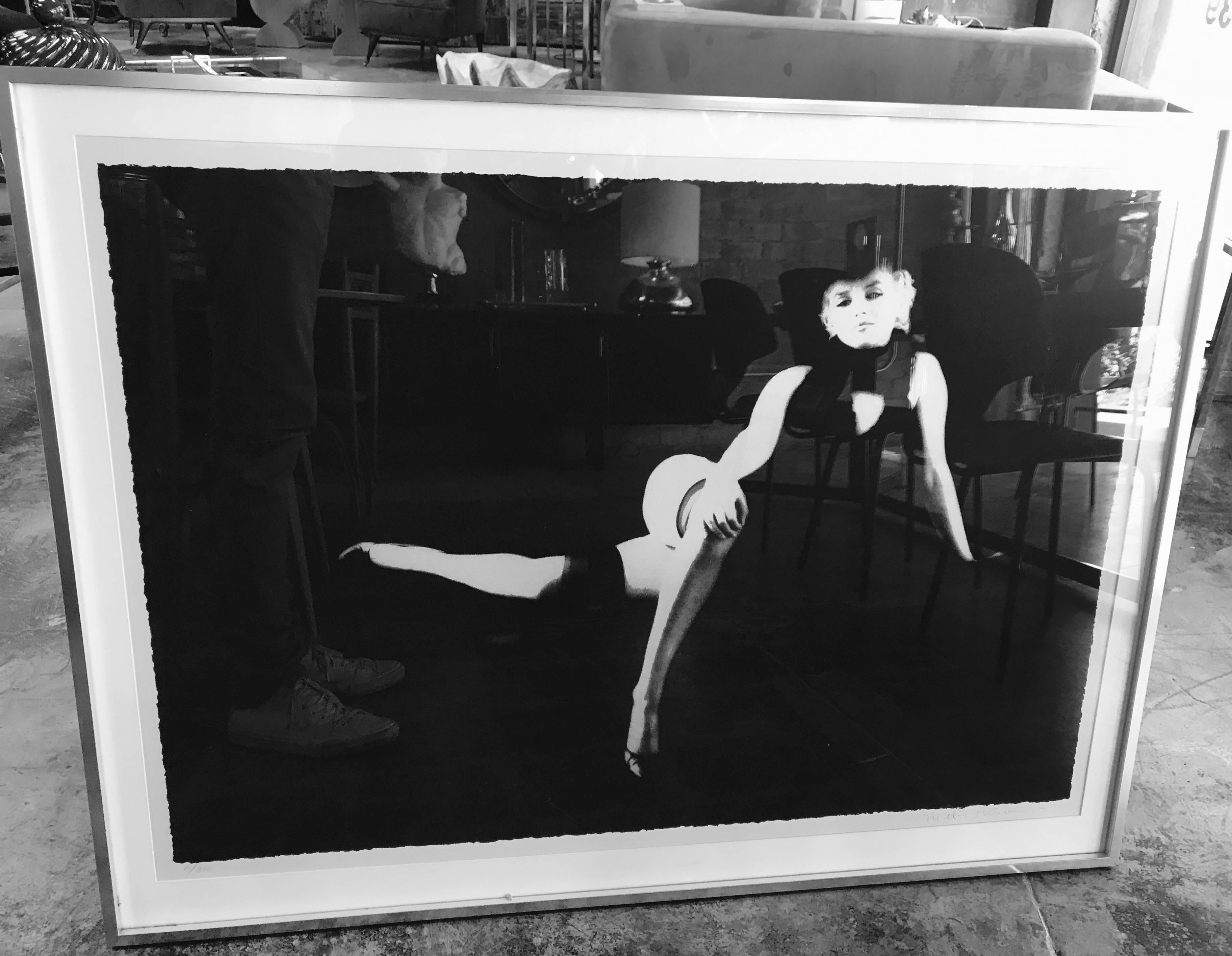 Milton H. Greene (1922-1985) 
Marilyn Monroe from The Black Sitting, 1956 
Photolithograph, printed later 
Signed in pencil and numbered from the edition: 6/300 
Metal frame.