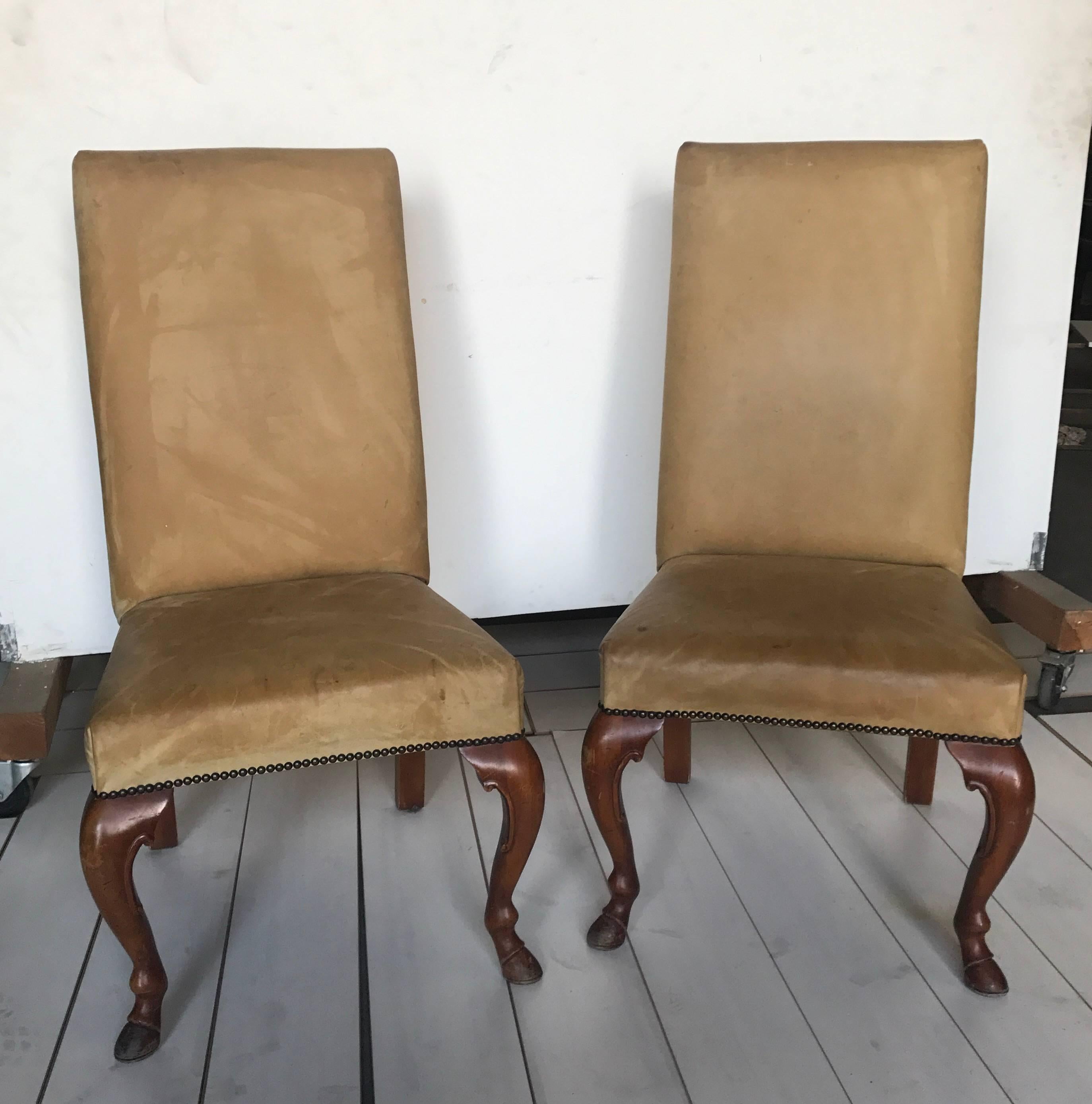 Pair of Ralph Lauren chairs in leather with cabriolet walnut legs. Labelled.