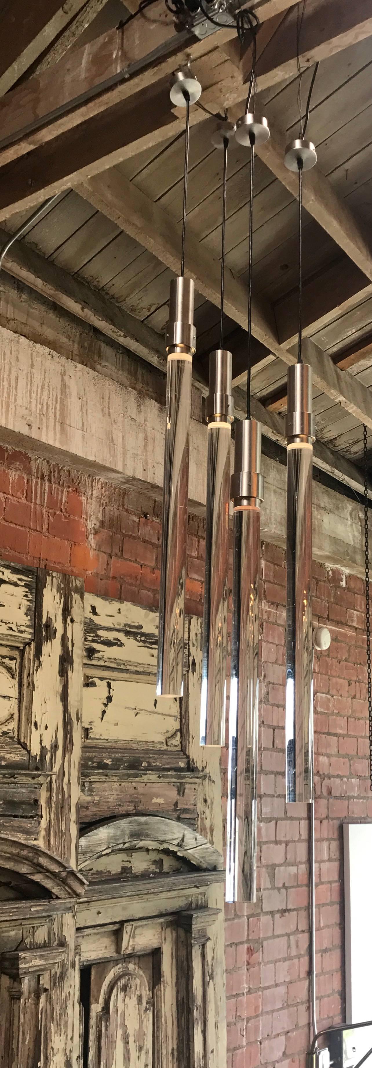 Lovely plexiglas and steel pendant lights just in from Italy.