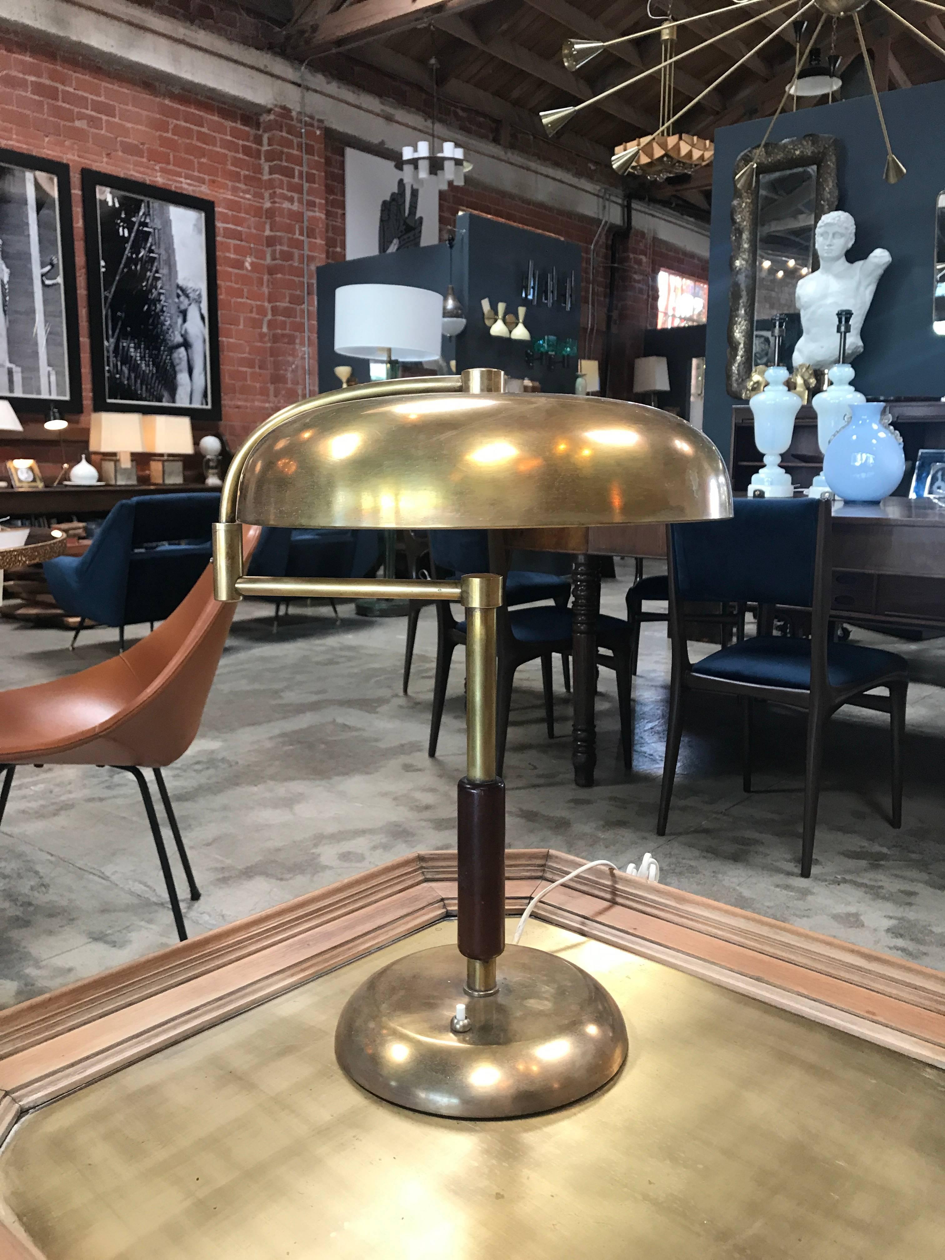 1960s swing arm desk lamps in brass and wood.