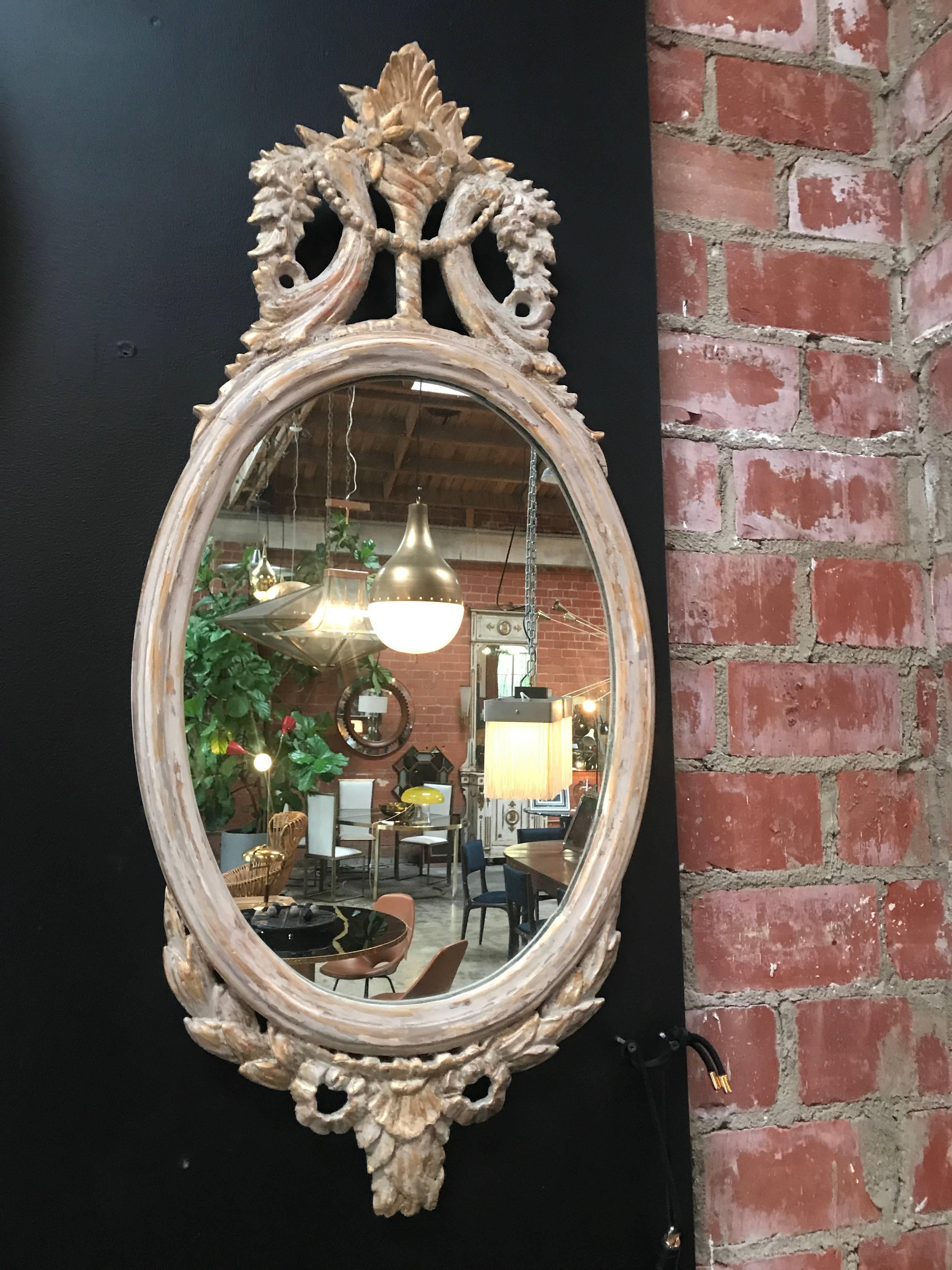 Northern European early 19th century oval carved wood mirror with white frame
great detail, great mirror, great patina- bello!