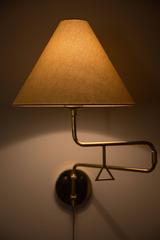 Pair of Brass Pivoting Sconces Made in Sweden