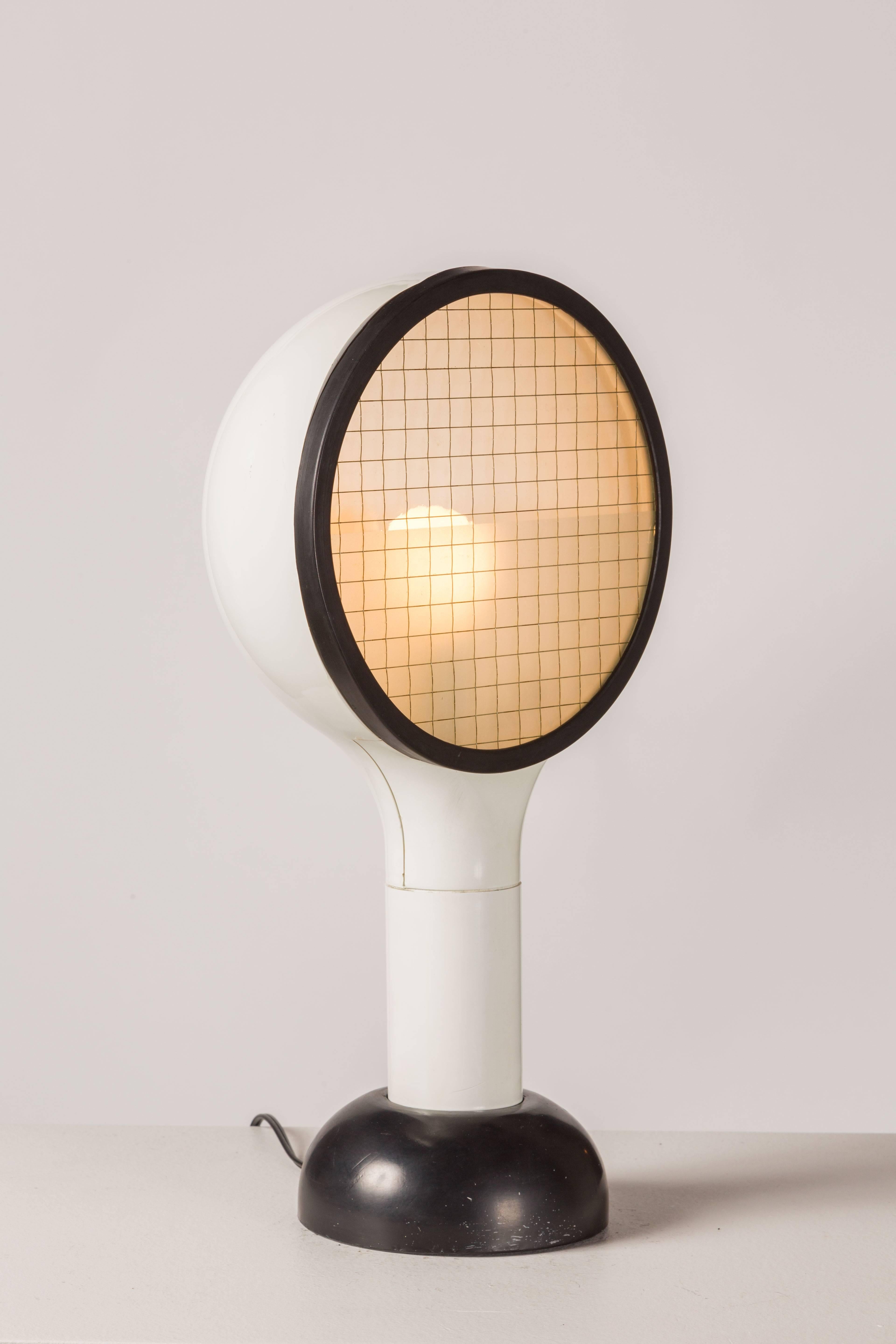 Two table lamps in white plastic with black rubber base. Designed by Adalberto Dal Lago for Bieffeplast in 1974. Safety glass with wire grid. Lower half of safety glass is sandblasted. E26 75W maximum bulb. Original cord.