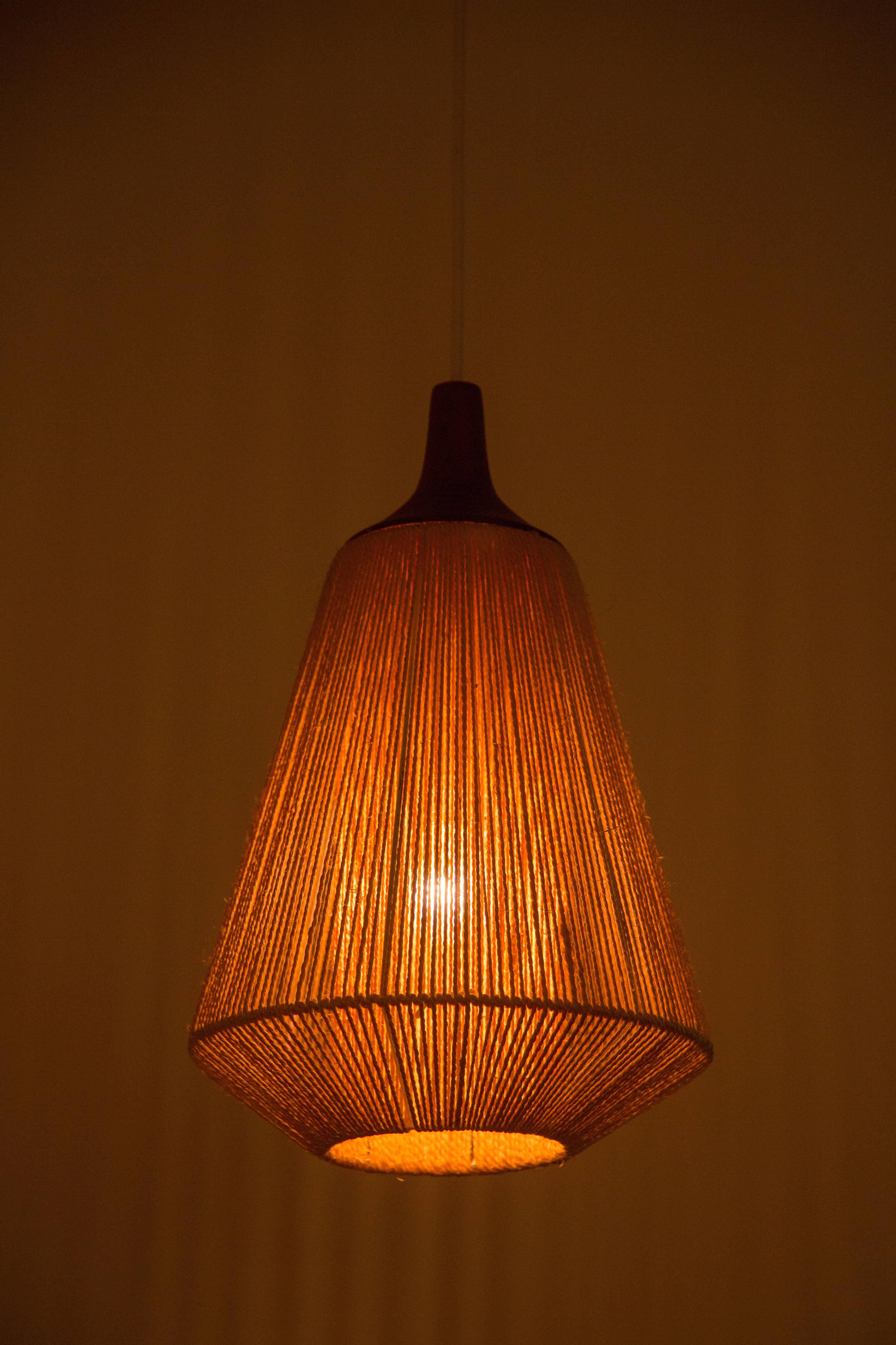 Teak and jute pendants created by Fog & Mørup. E27 75 maximum bulbs. Original wiring.