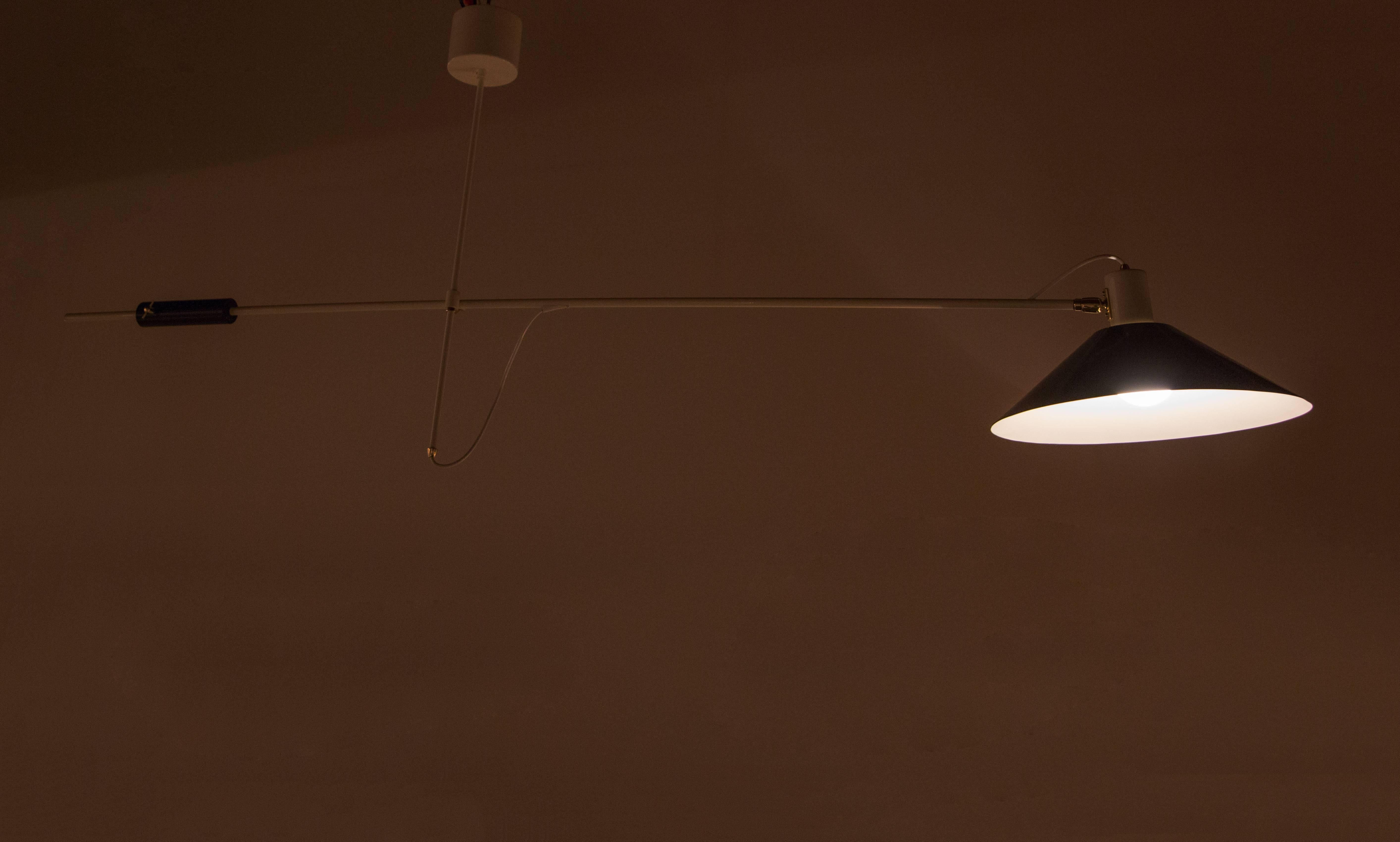 A fully restored counter balance ceiling light with pivoting arm and shade.
Designed by Anvia for J.J.M Hoogervorst.
    
  