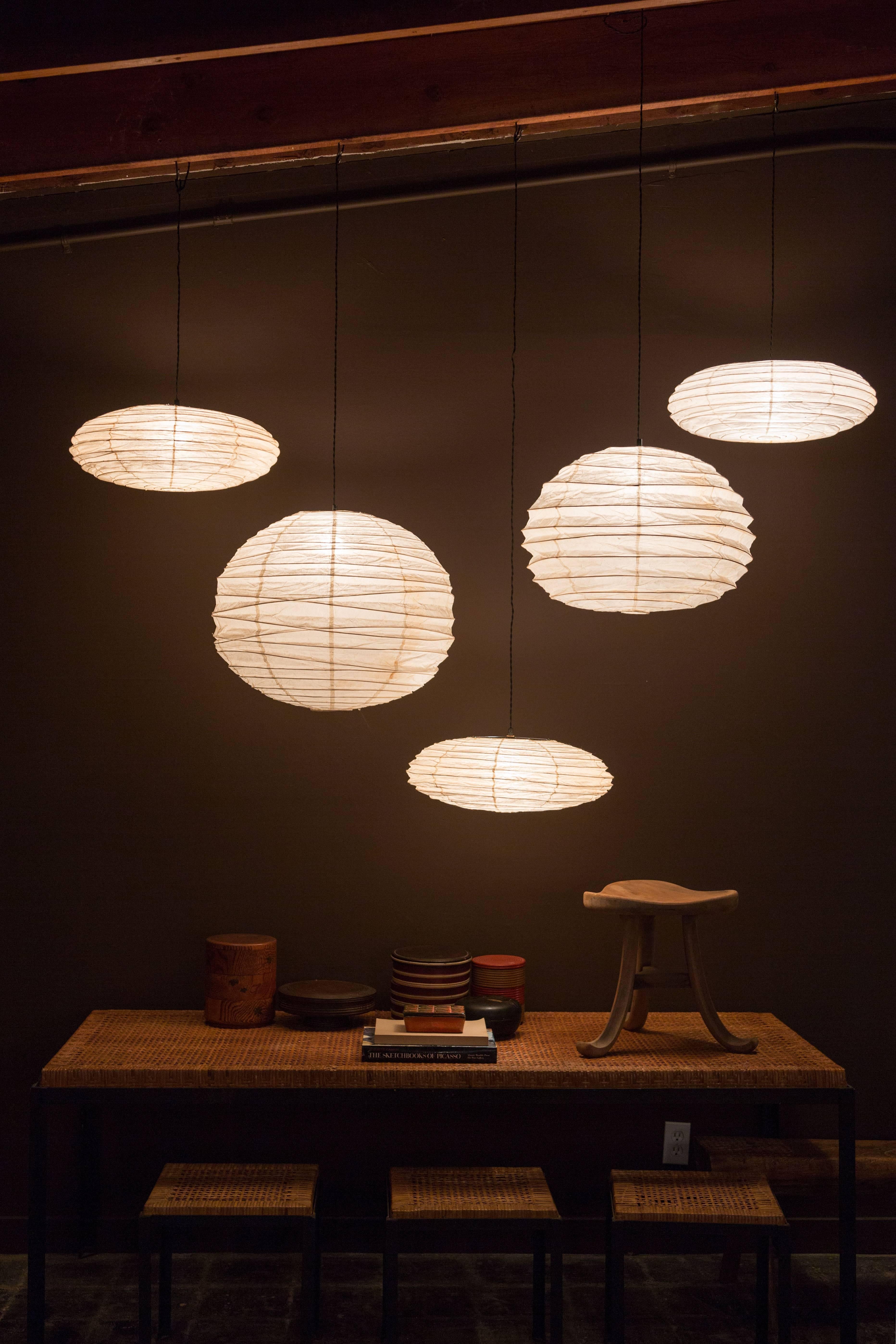 Designed by Noguchi and handmade for over a half century by the original manufacturer in Gifu, Japan, the paper lanterns are a blend of Japanese handcraft and modernist form. The lamps are created from handmade washi paper and bamboo ribbing,