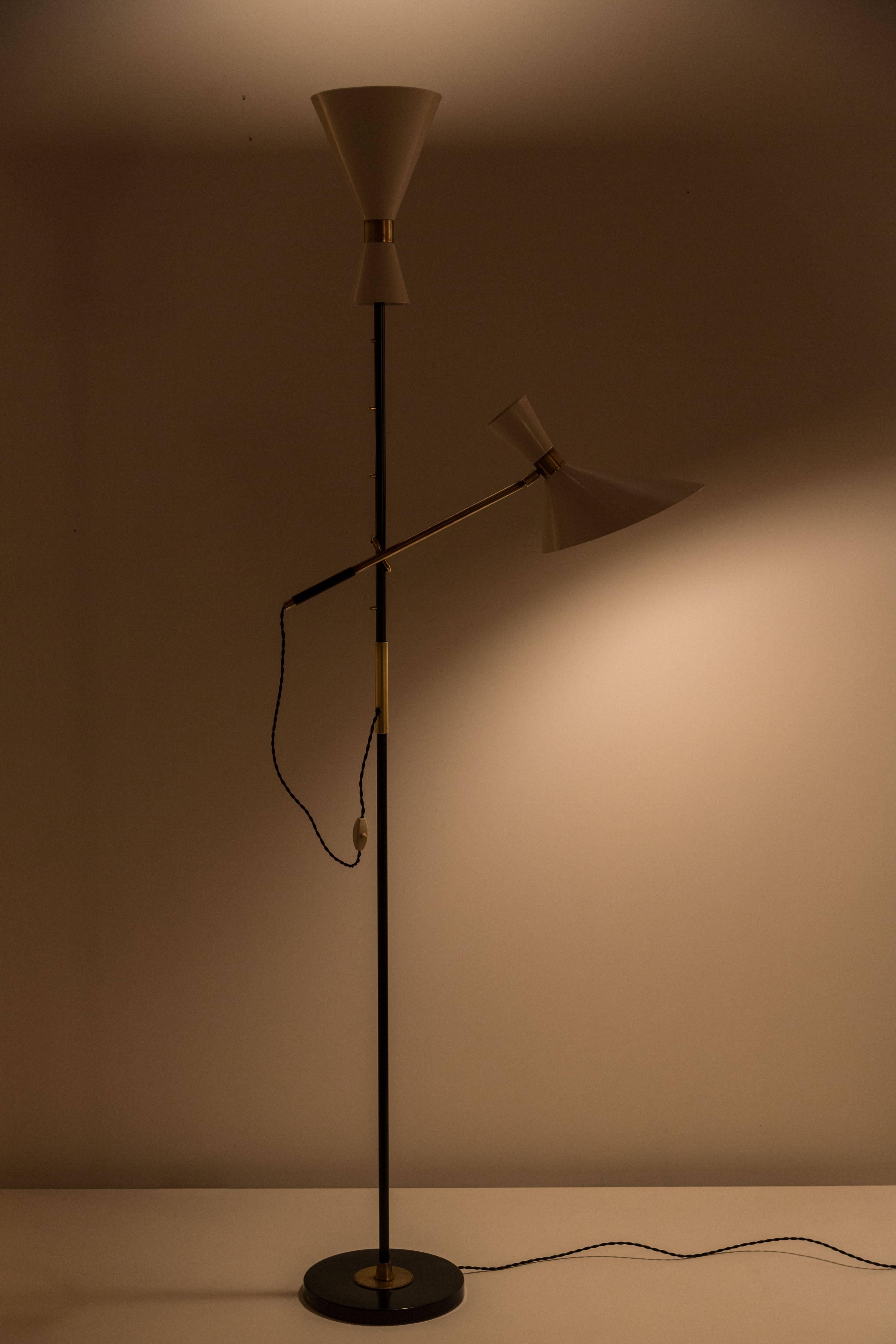 An Austrian Floor lamp designed by Kalmar Lighting 
Rewired with original switches in tact and shades have been 
restored to their original color.
