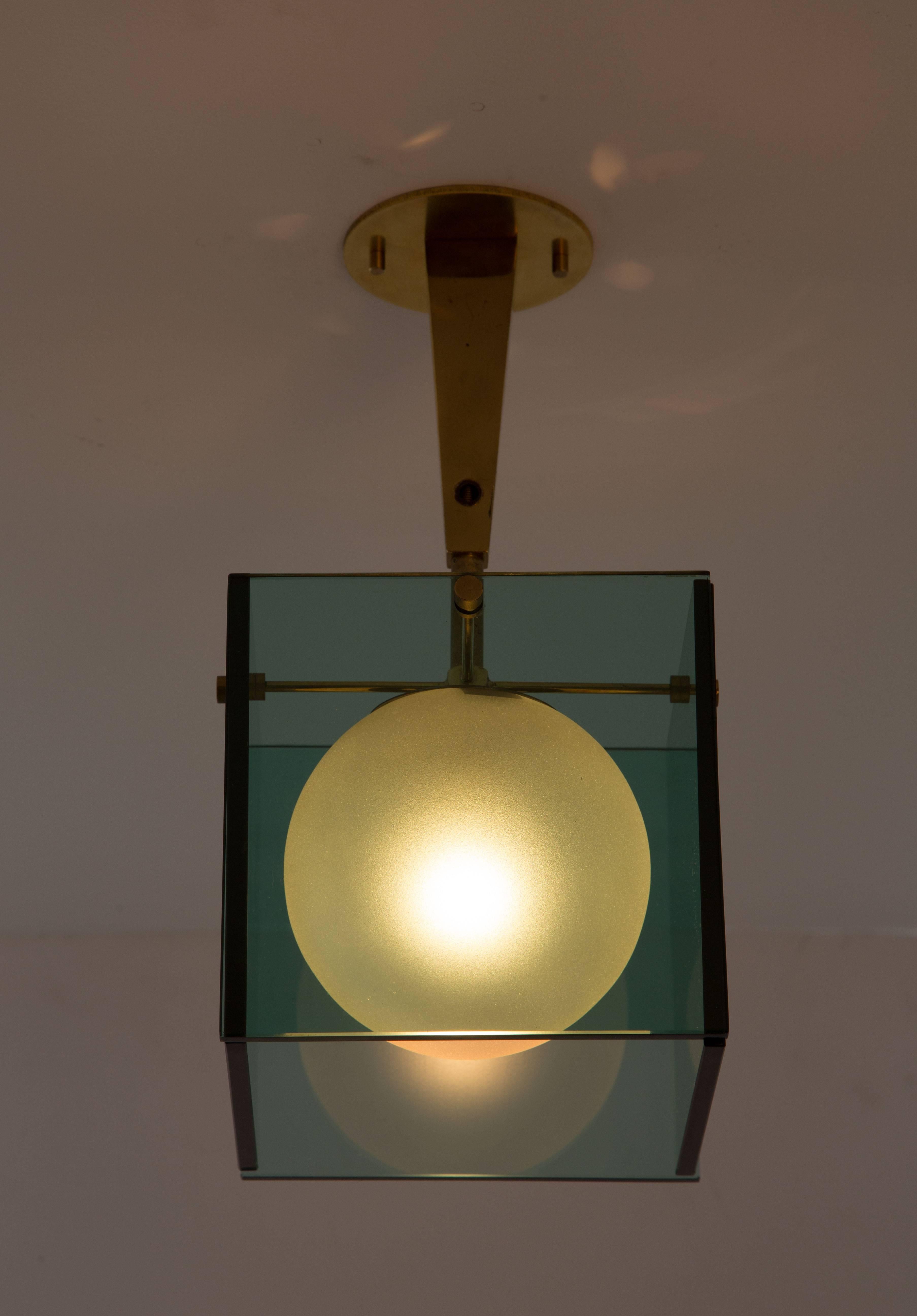 Flush mount ceiling light made of green glass with frosted, textured glass globe and brass hardware. Designed by Max Ingrand for Fontana Arte. Rewired. Custom canopy. E27 60w maximum bulb.
