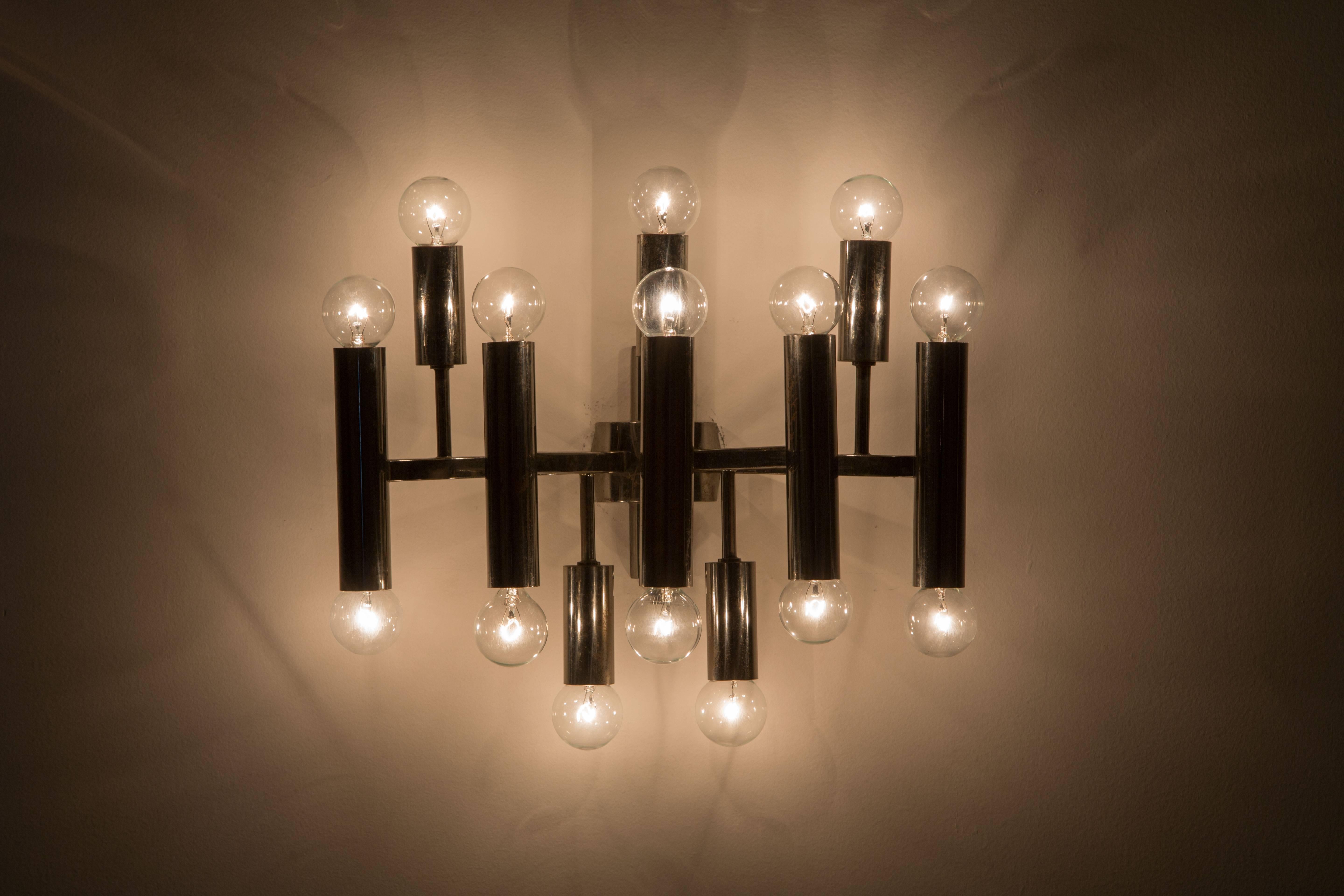 Pair of multi-Directional sconces plated in black nickel. Made in Italy in the 1960s. Rewired for US junction boxes. Each sconce takes fifteen E14 15w maximum European candelabra bulbs.