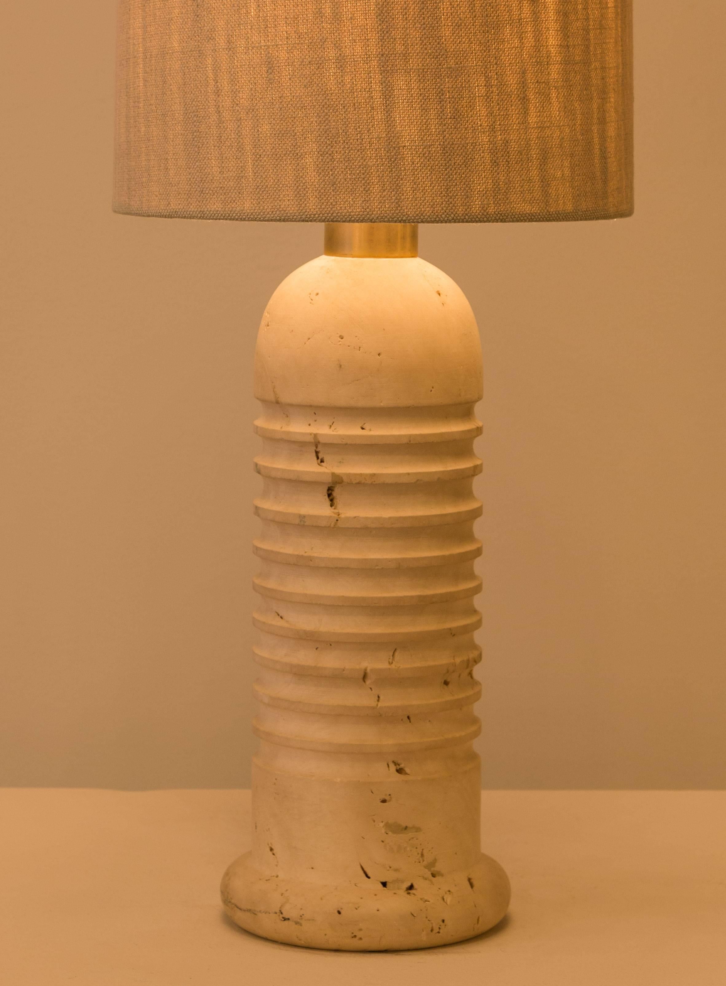 Pair of carved travertine table lamps made in Italy in the 1970s.  Original cords. Takes two E27 75w maximum bulbs per light. Shades not included