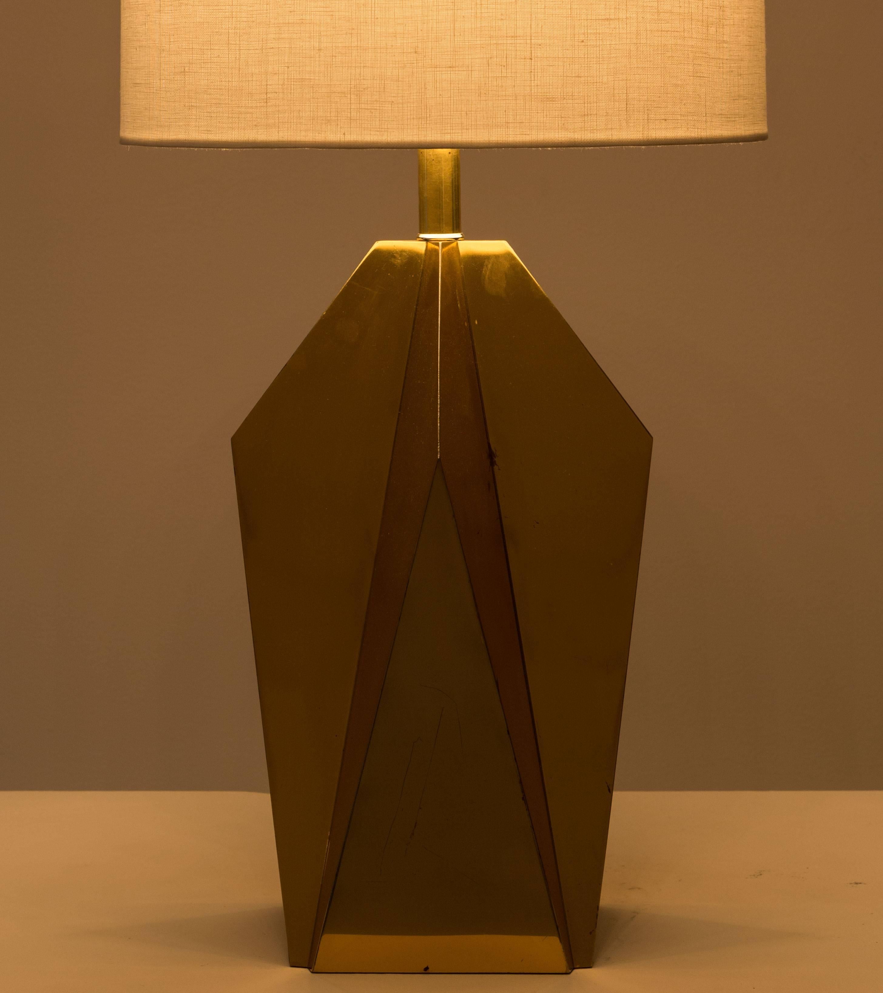 Pair of brass table lamps with geometric metal work. Designed in the U.S. in the 1960s. Shades not included. Original cords. Takes two E26 75w maximum bulbs.
