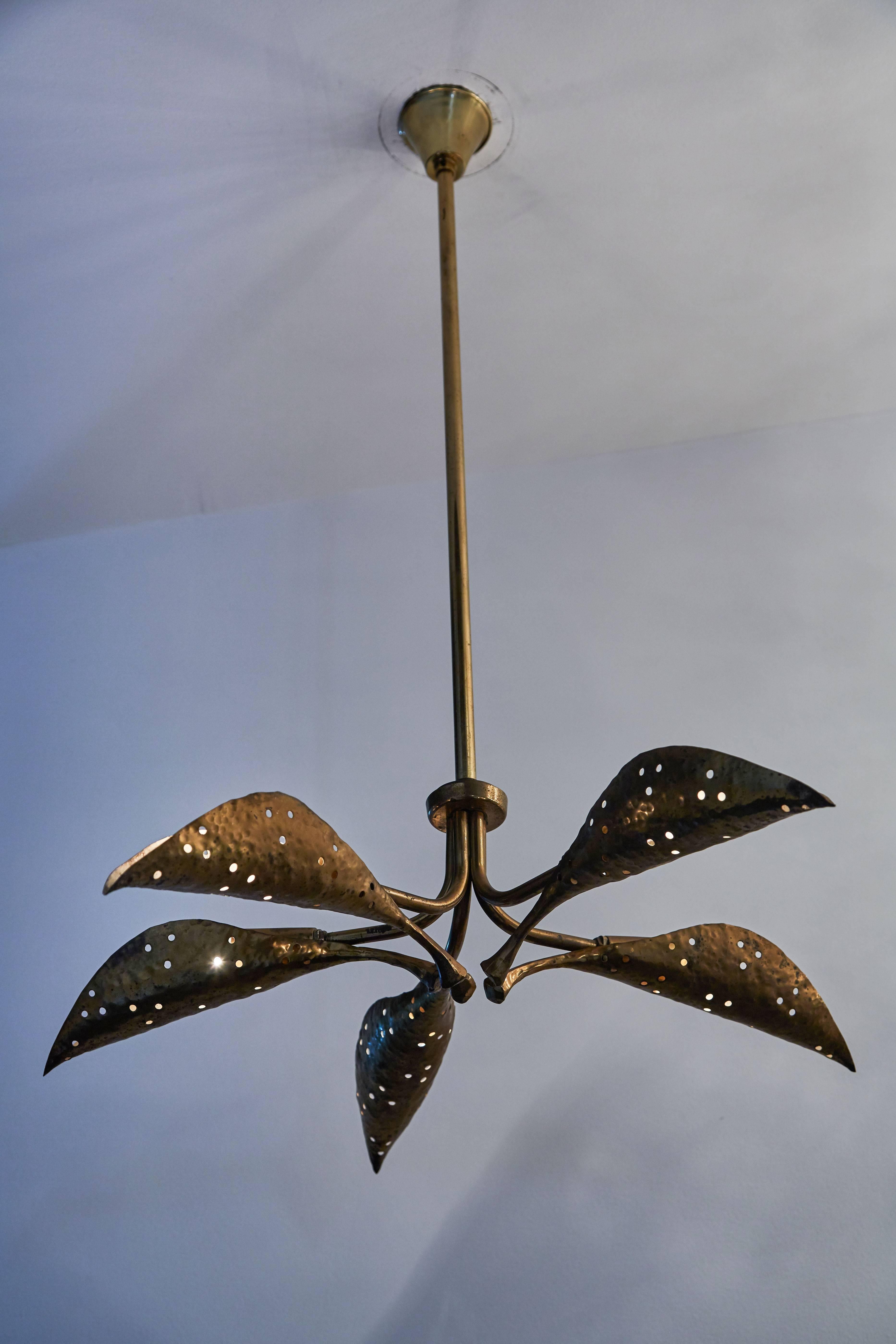 Rare five-arm textured and hammered solid brass chandelier. Small hand made perforations to brass. Takes five E14 European candelabra 40w maximum bulbs.