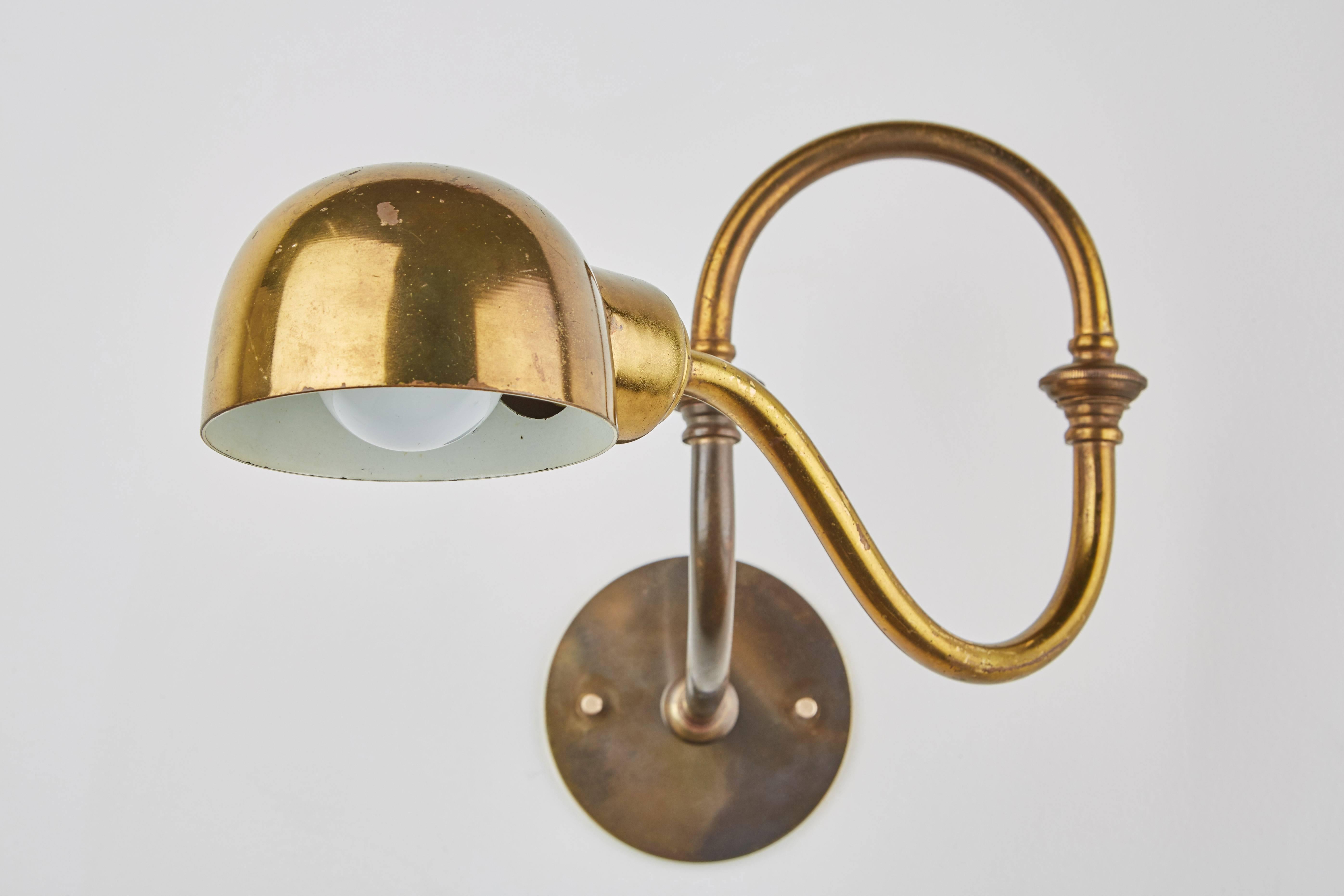 Pair of brass Lp15 Tromba sconces by Luigi Caccia Dominioni for Azucena. Designed in Italy, 1964. Sconce adjust to various positions. Custom backplates. Wired for US junction boxes. Each sconce takes one E27, 75w maximum bulb.