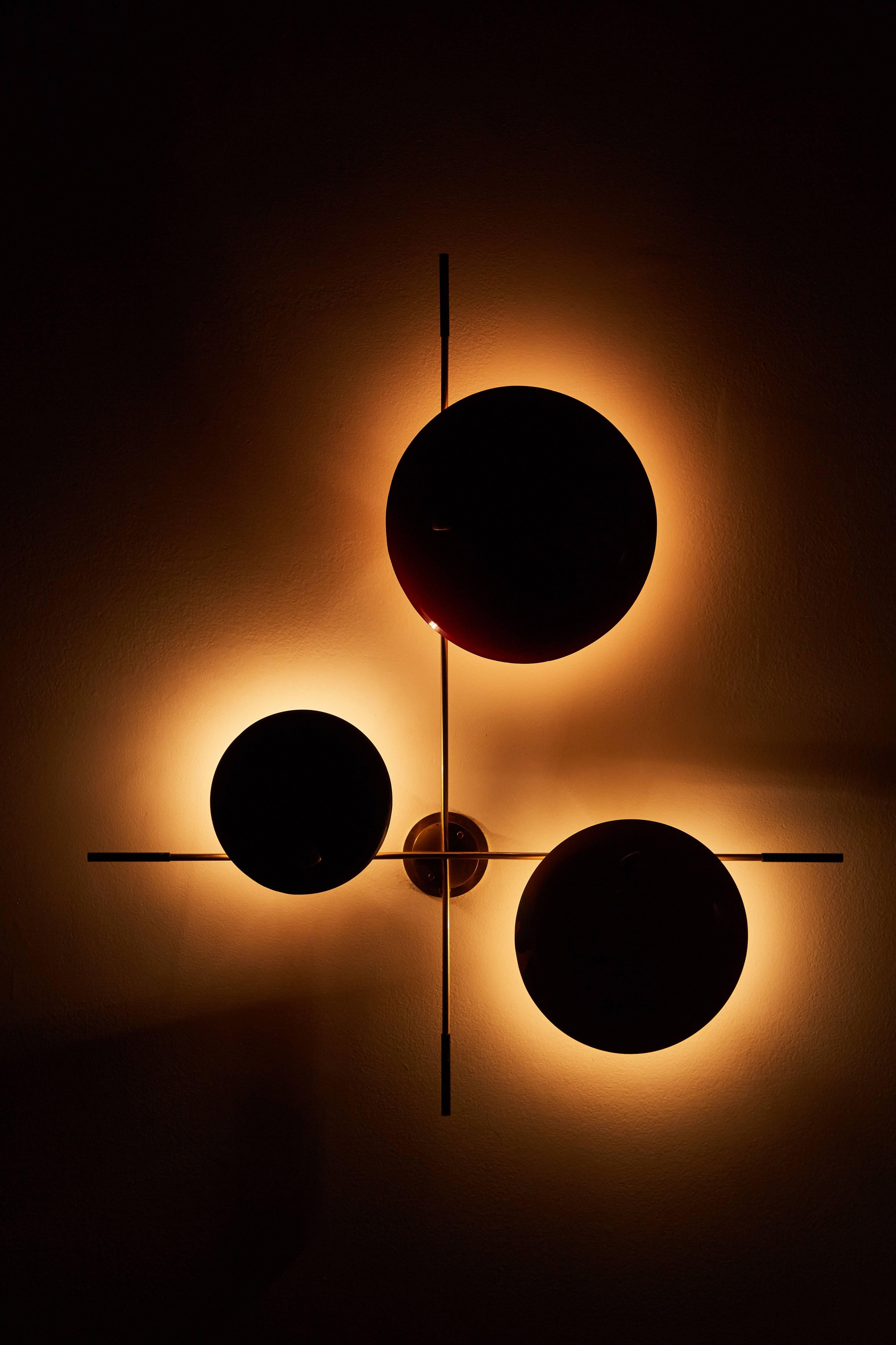 Bruno Gatta three shade asymmetrical wall light. Each colored shade houses a single E14 lamp. This lamp can be mounted in various positions. Shades are in there original color and condition. Can be touched up or repainted if desired.