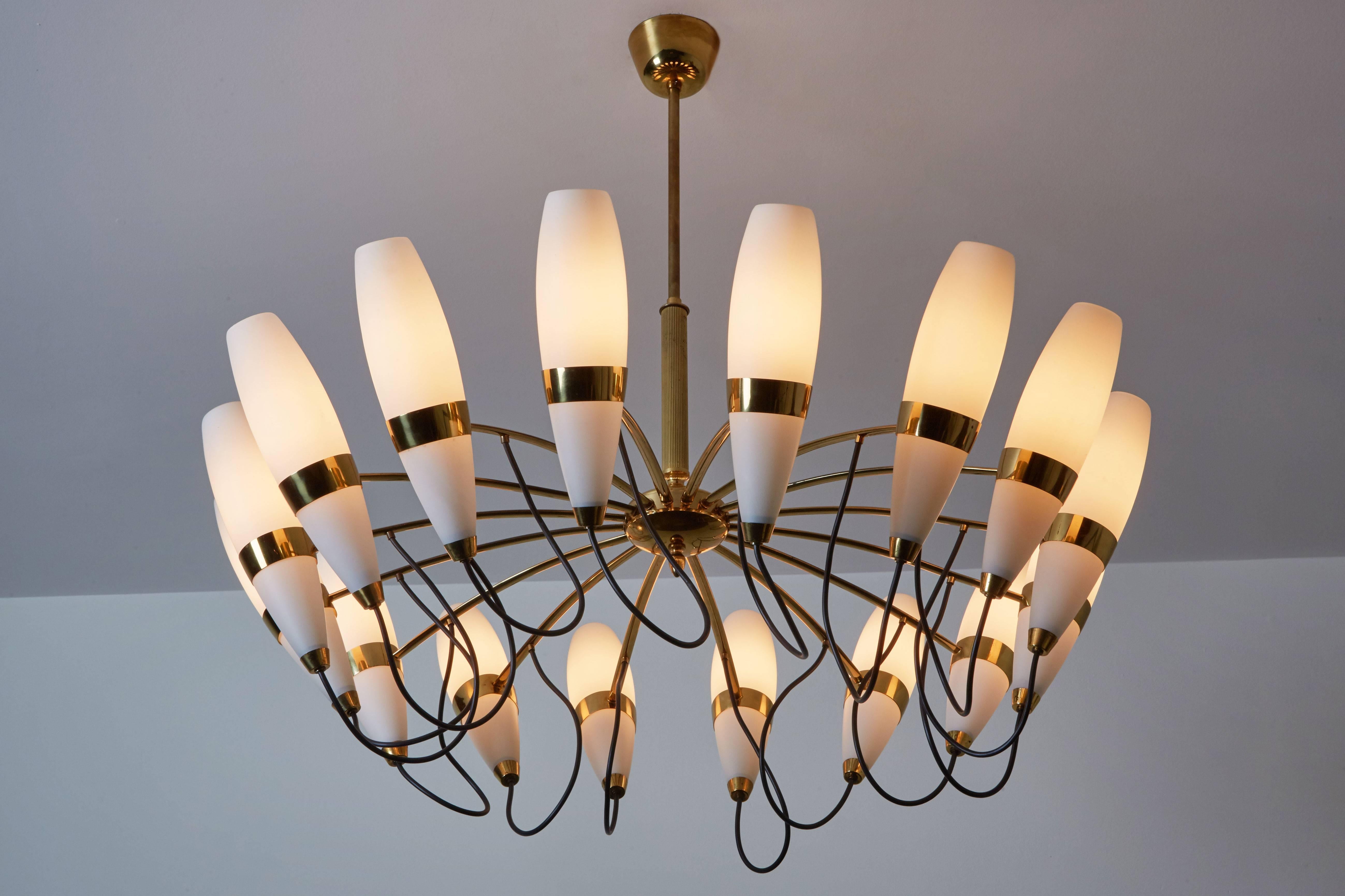 Sixteen shade chandelier manufactured by Stilnovo in Italy, circa 1950s. Brushed satin glass and brass. Original canopy. Rewired for US junction boxes. Each shade takes one E14 25w maximum E14 bulb.
