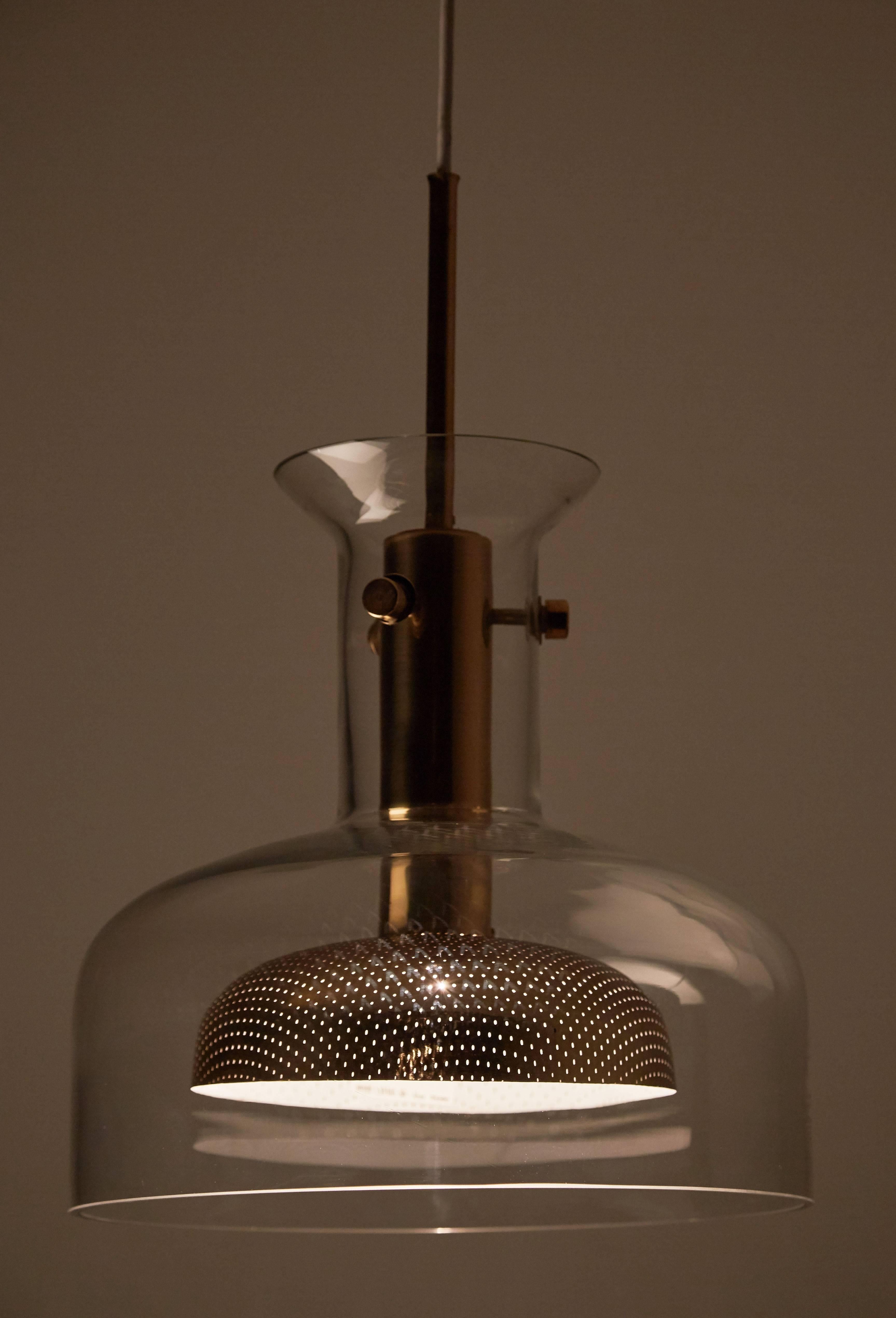 Crystal' Ceiling Light by Anders Pehrson for Atelje Lyktan. Designed in Sweden circa 1970s. Outer shade made of glass, the inner shade made of brass with small perforated holes. Retains original manufacturers label. Wired for US junction boxes.