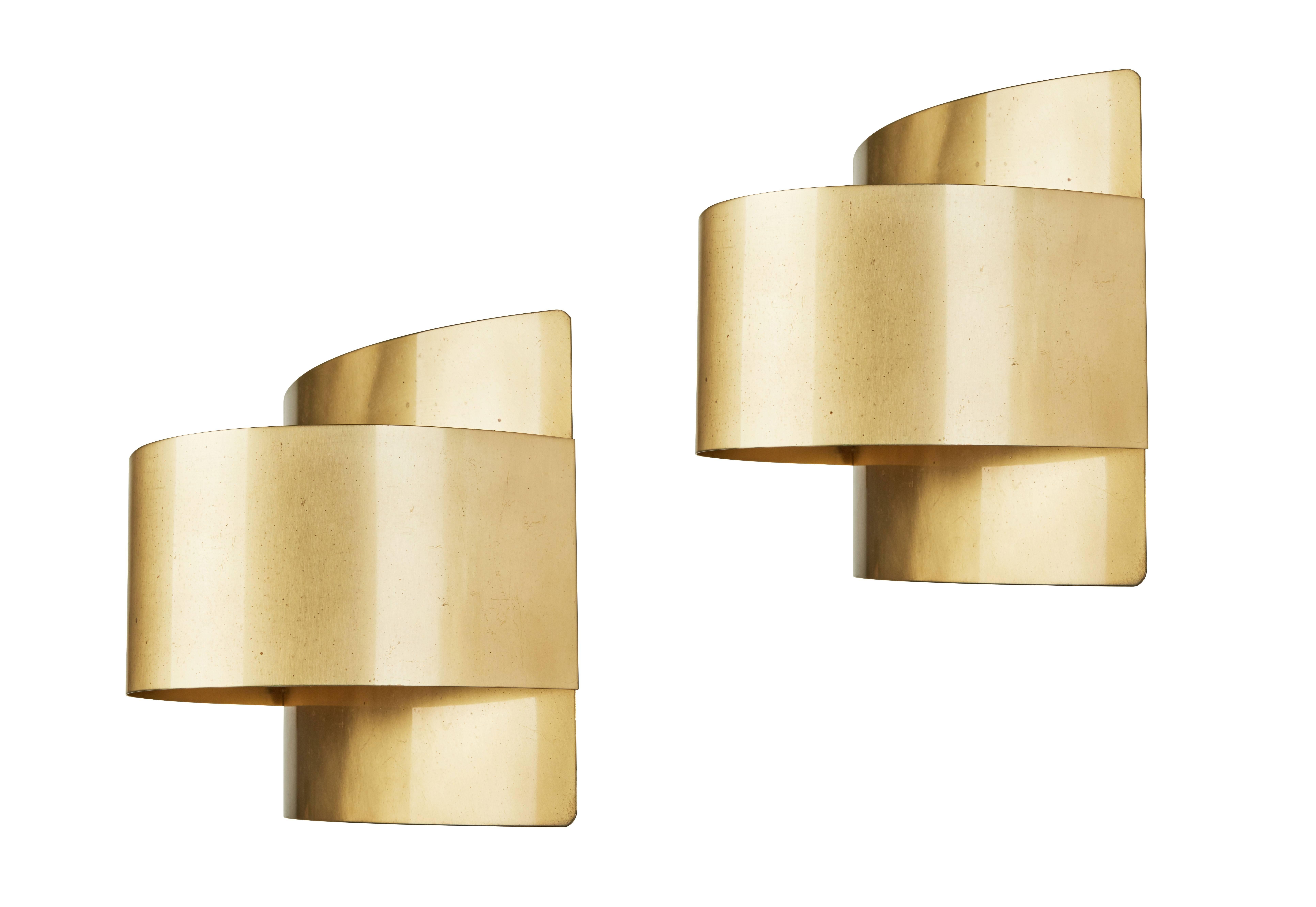 A pair of brass sconces by Falkenbergs Belysning. Designed in Sweden, circa 1960s. Wired for US junction boxes. Each sconces takes one E27 75w maximum bulb.


  